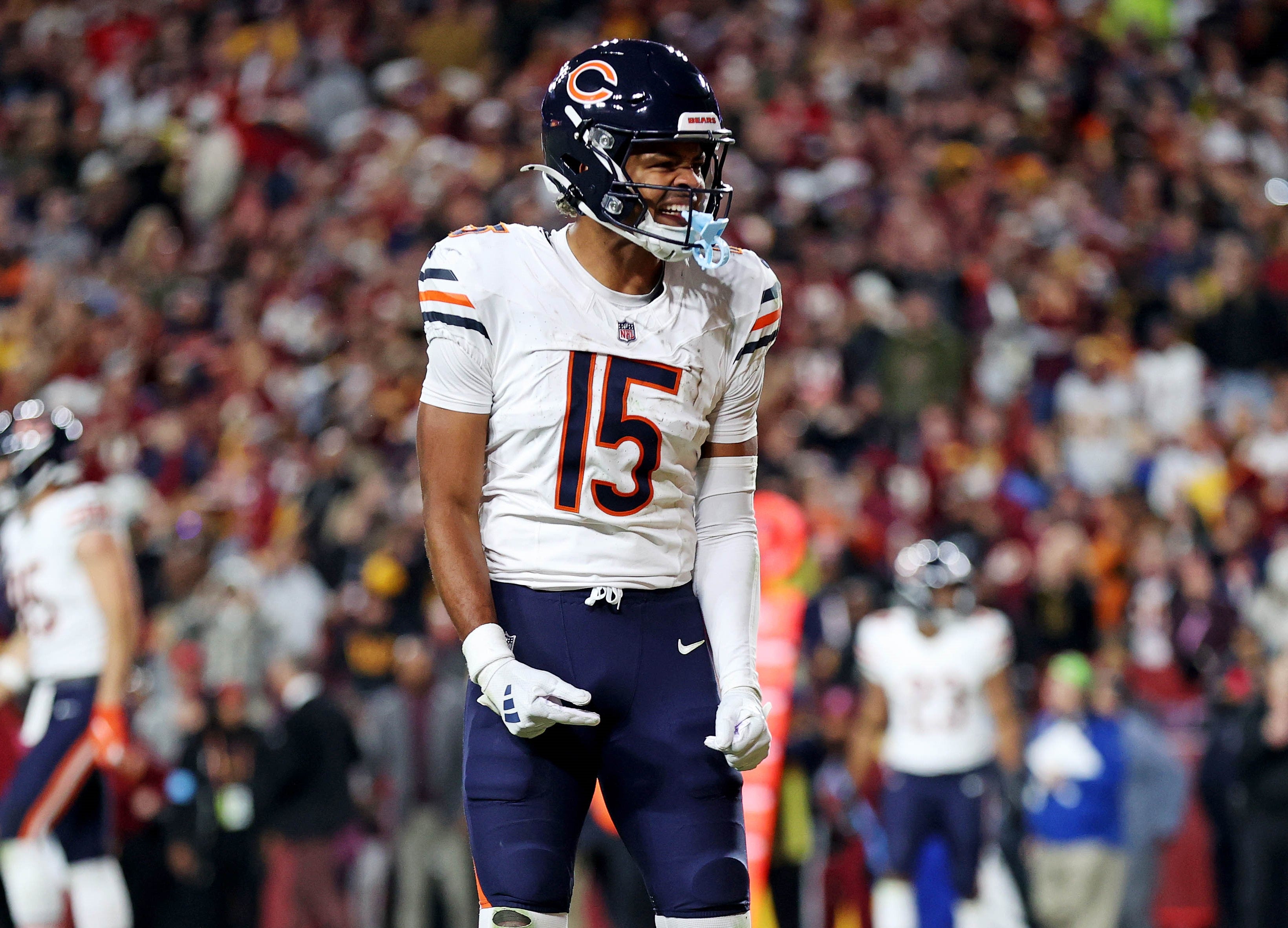Oct 27, 2024; Landover, Maryland, USA; Chicago Bears wide receiver Rome Odunze (15) celebrates after a pass interference call during the fourth quarter against the Washington Commanders at Commanders Field.