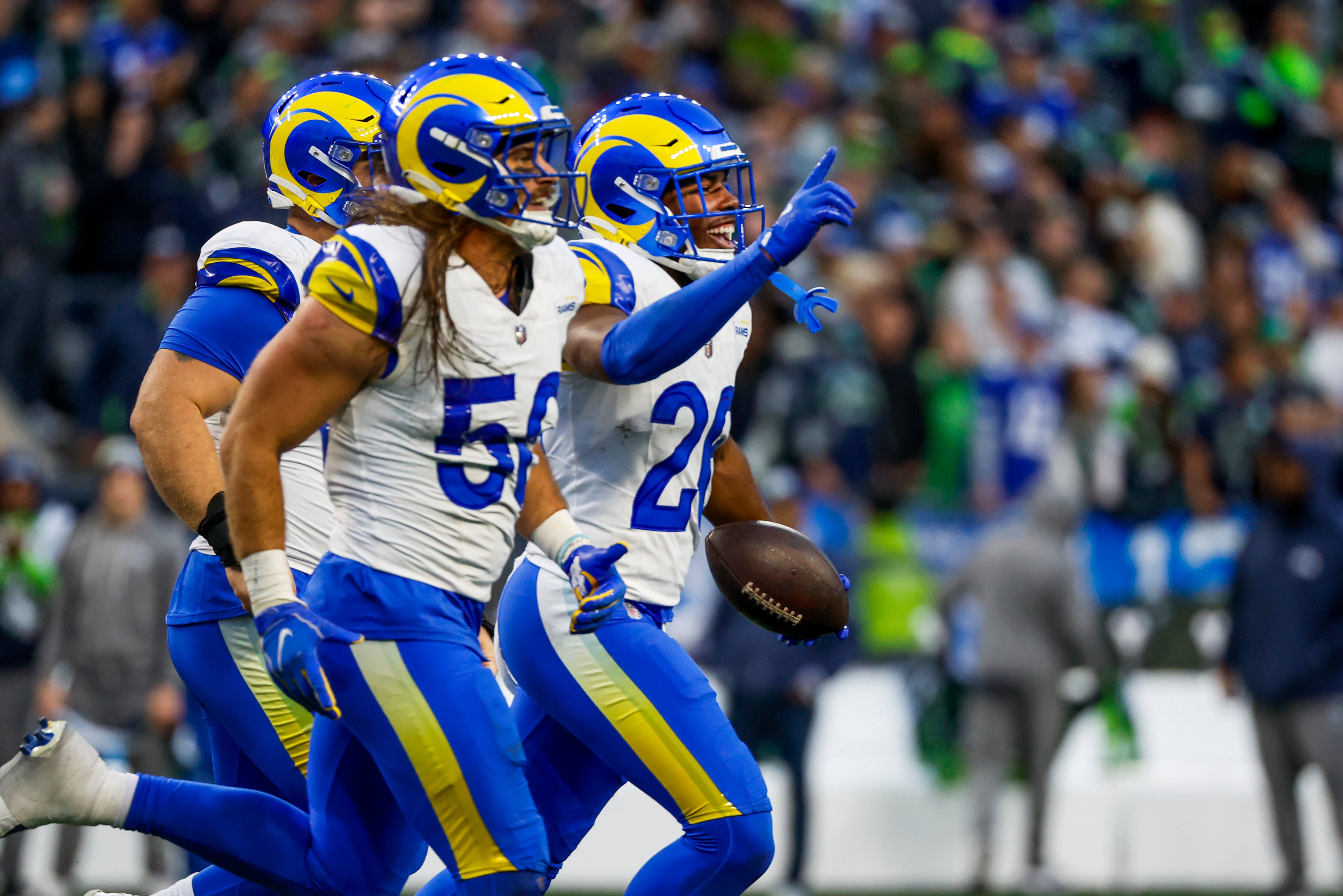 Nov 3, 2024; Seattle, Washington, USA; Los Angeles Rams safety Kamren Kinchens (26) celebrates following an interception against the Seattle Seahawks during the fourth quarter at Lumen Field.