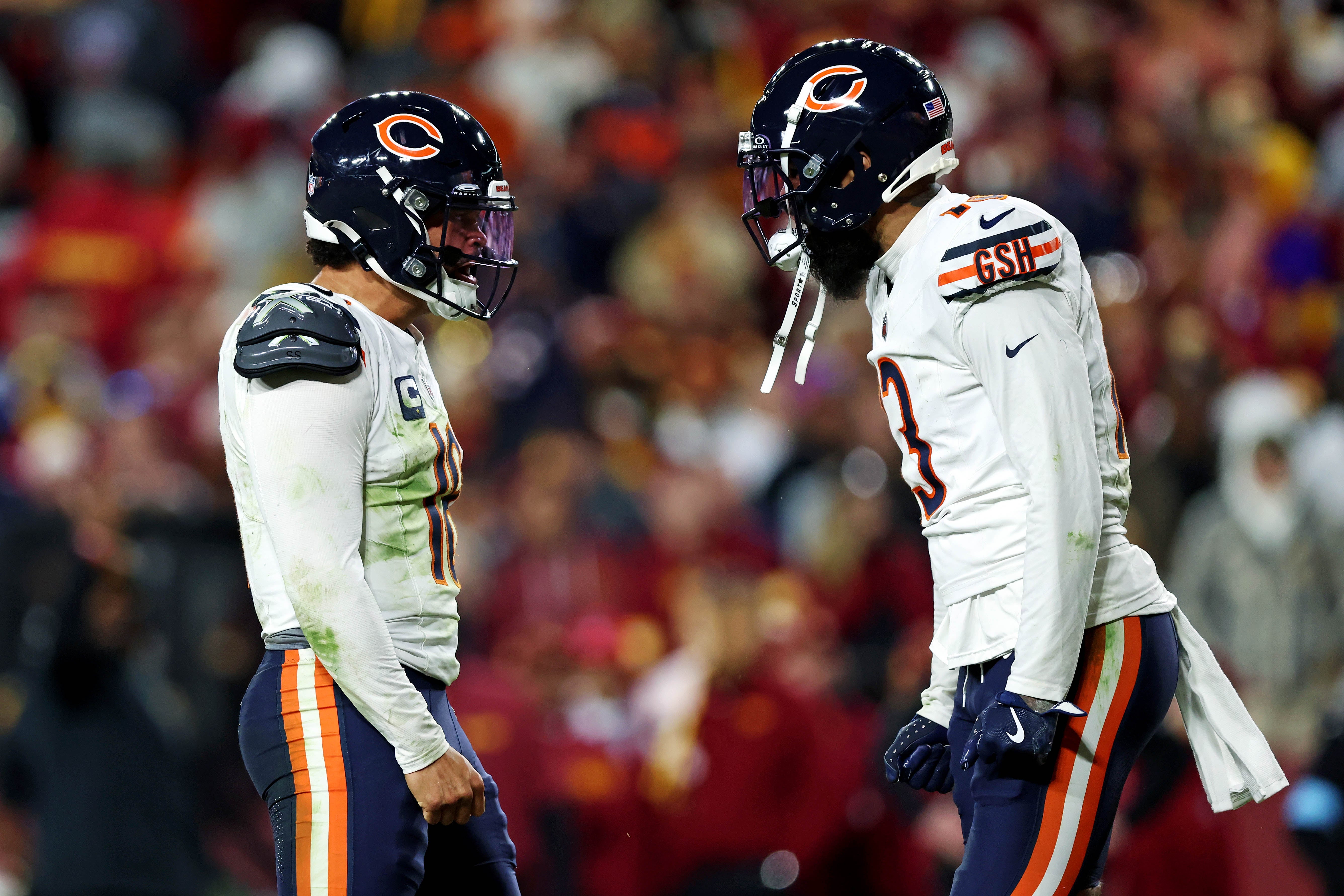 Oct 27, 2024; Landover, Maryland, USA; Chicago Bears quarterback Caleb Williams (18) celebrates with wide receiver Keenan Allen (13) after the Bears scored a touchdown during the fourth quarter against the Washington Commanders at Commanders Field.