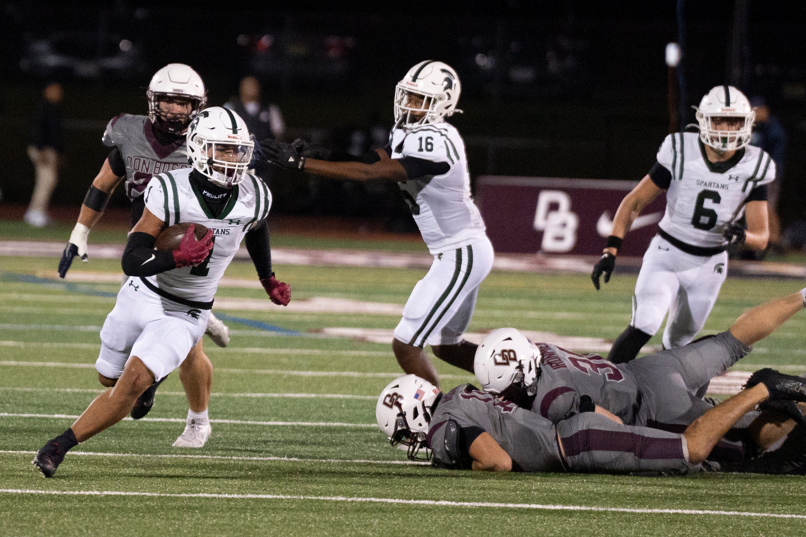 Oct 4, 2024; Ramsey, New Jersey, United States; DePaul football at Don Bosco. DP #1 Nolan James Jr. avoids a tackle.