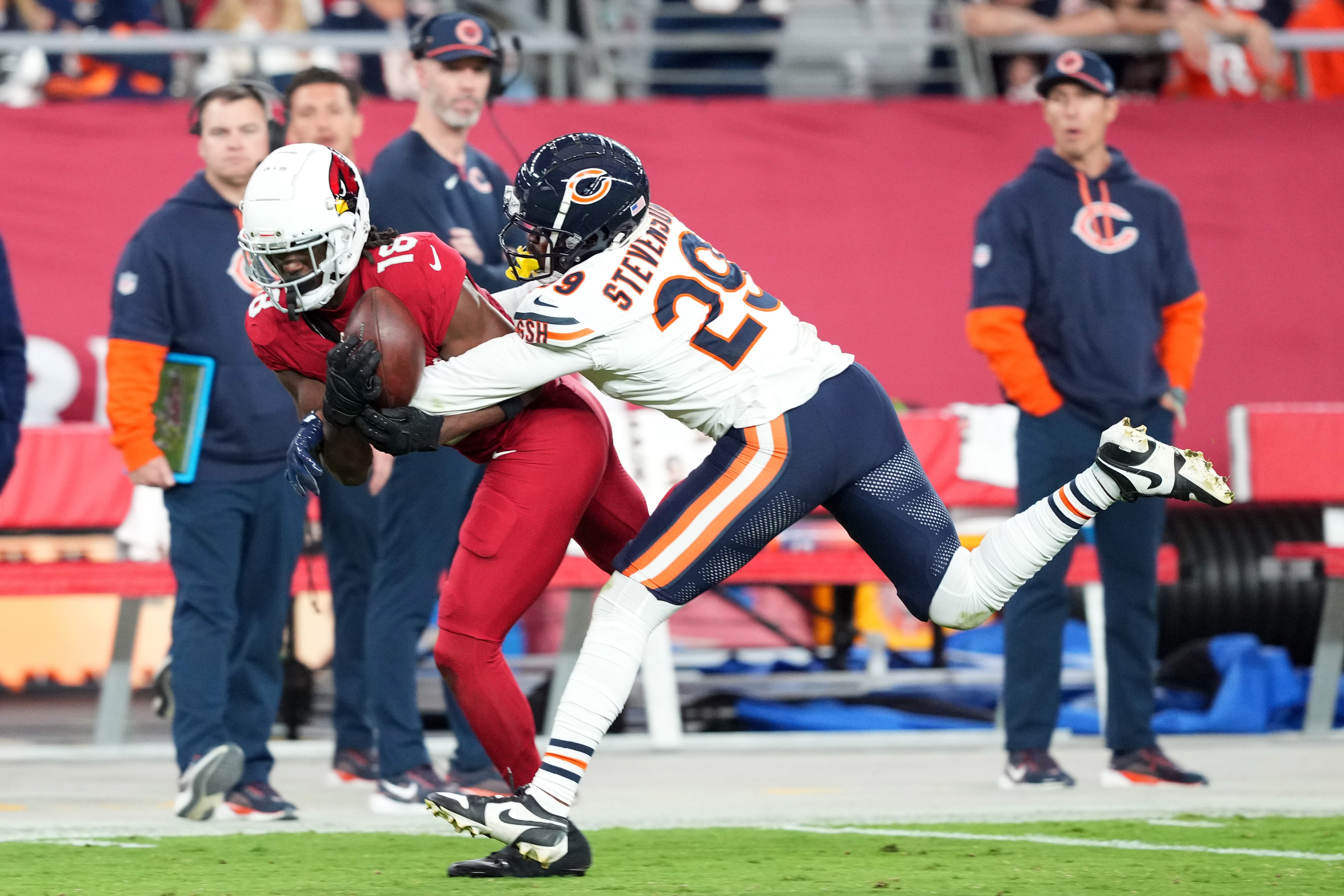 Nov 3, 2024; Glendale, Arizona, USA; Chicago Bears cornerback Tyrique Stevenson (29) breaks up a pass intended for Arizona Cardinals wide receiver Marvin Harrison Jr. (18) during the second half at State Farm Stadium.