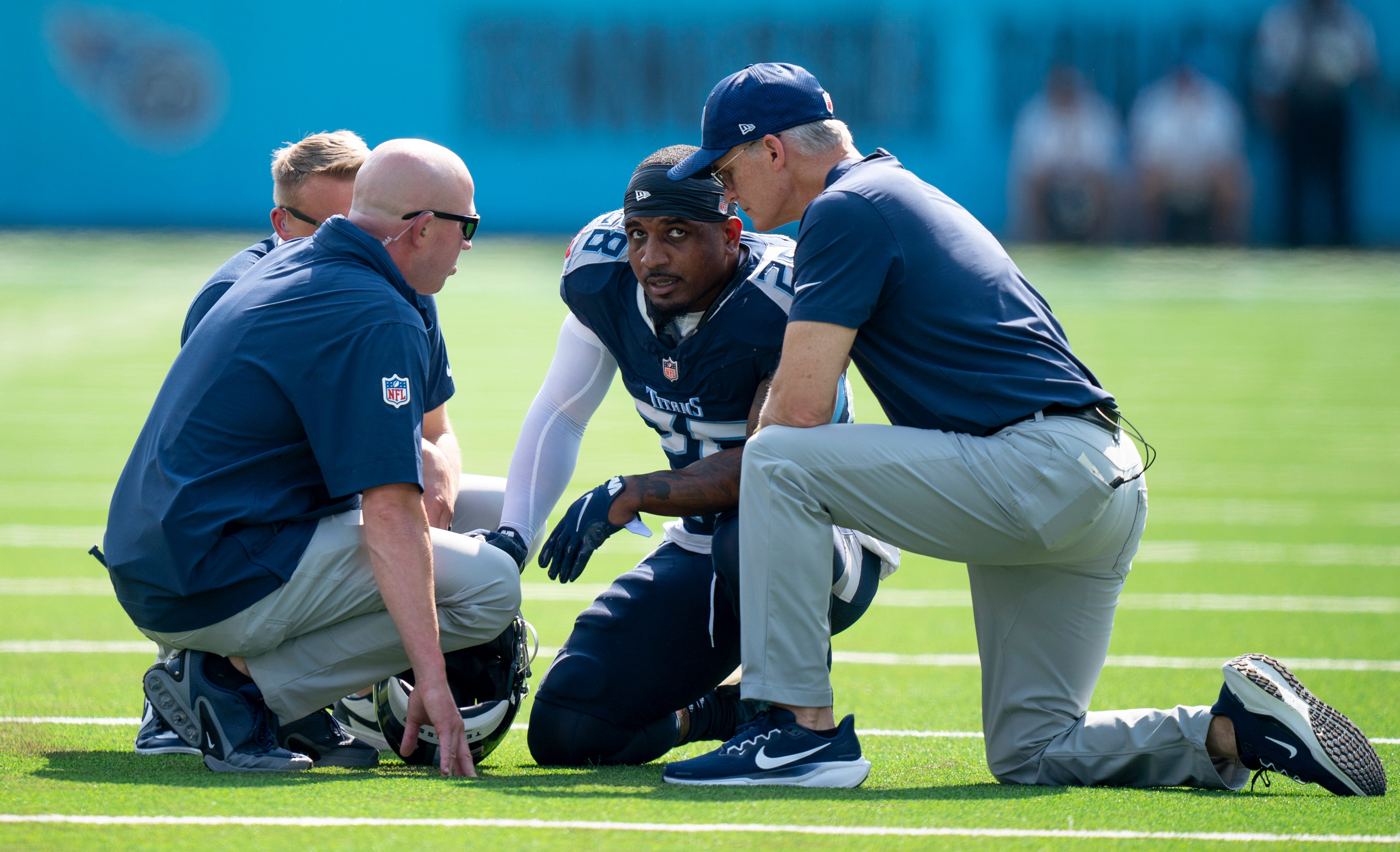 Tennessee Titans safety Quandre Diggs (28) is looked at on the field after getting shaken up on a tackle against the Indianapolis Colts during the first quarter their game at Nissan Stadium in Nashville, Tenn., Sunday, Oct. 13, 2024.