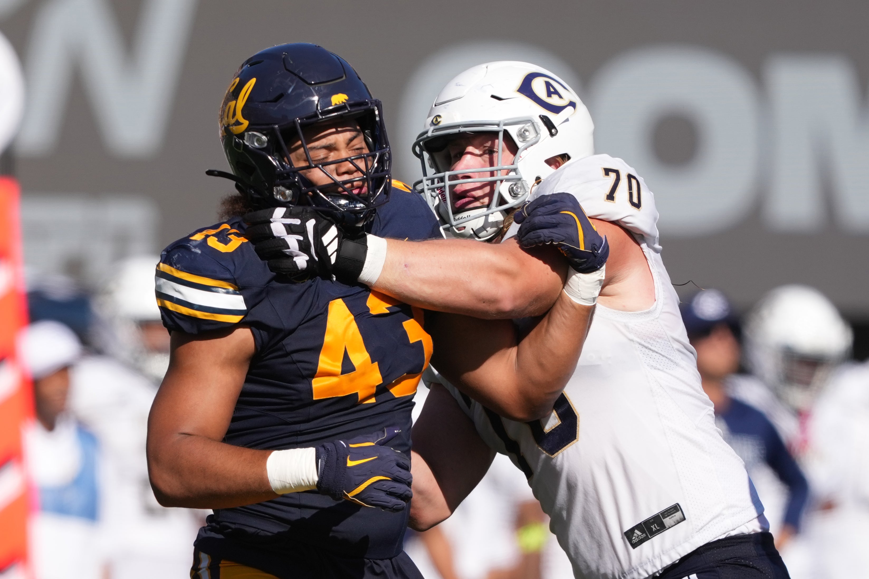 UC Davis Aggies offensive lineman Eli Simonson (70) blocks California Golden Bears linebacker Ryan McCulloch (43) during the third quarter at California Memorial Stadium.