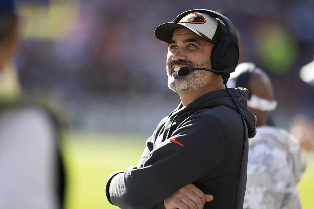 Cleveland Browns head coach Kevin Stefanski smiles between plays while watching the video scoreboard during the first quarter against the Los Angeles Chargers at Huntington Bank Field.