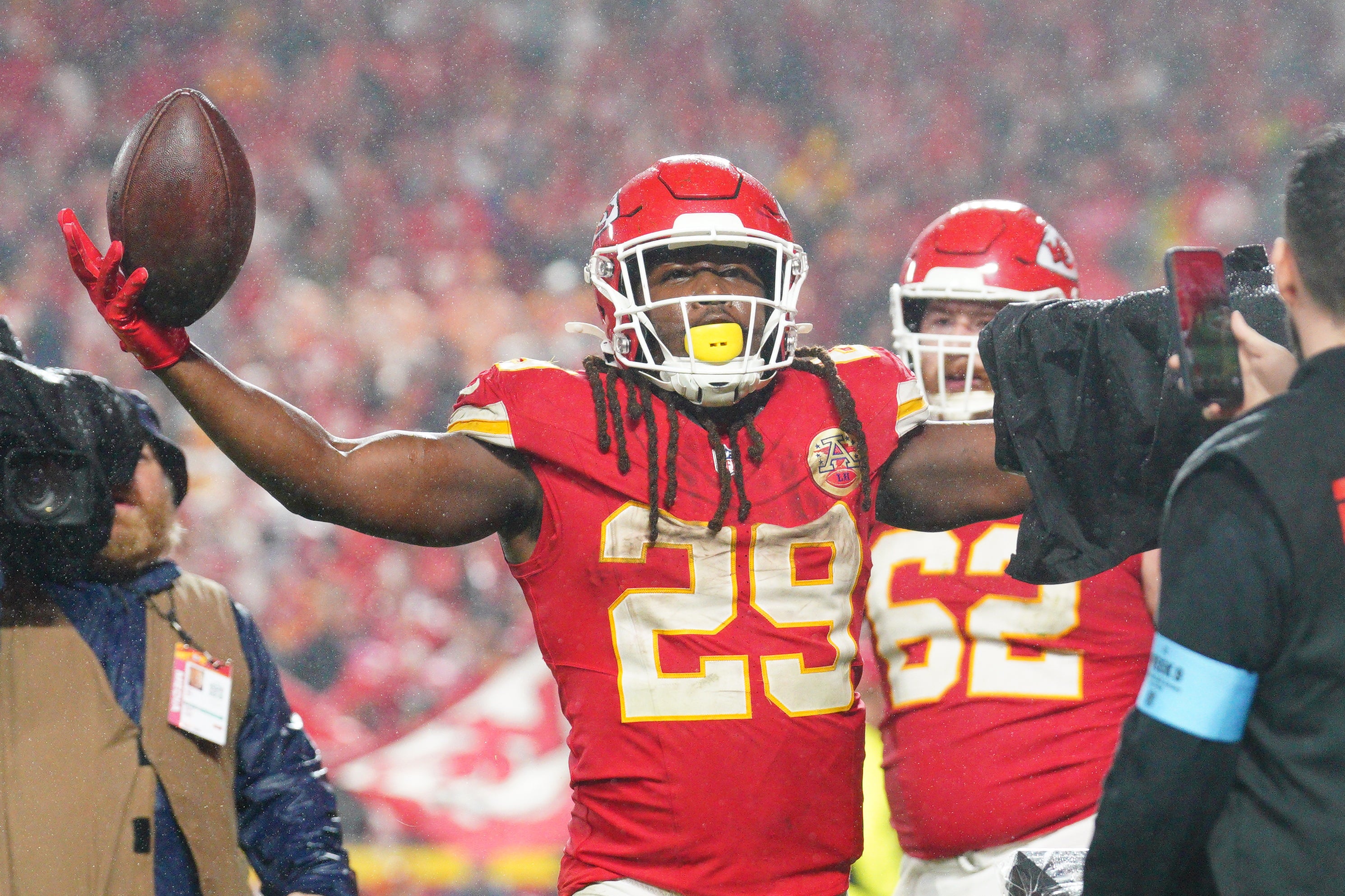 Chiefs RB Kareem Hunt celebrates toward fans after scoring the game-winning touchdown in overtime against the Buccaneers.