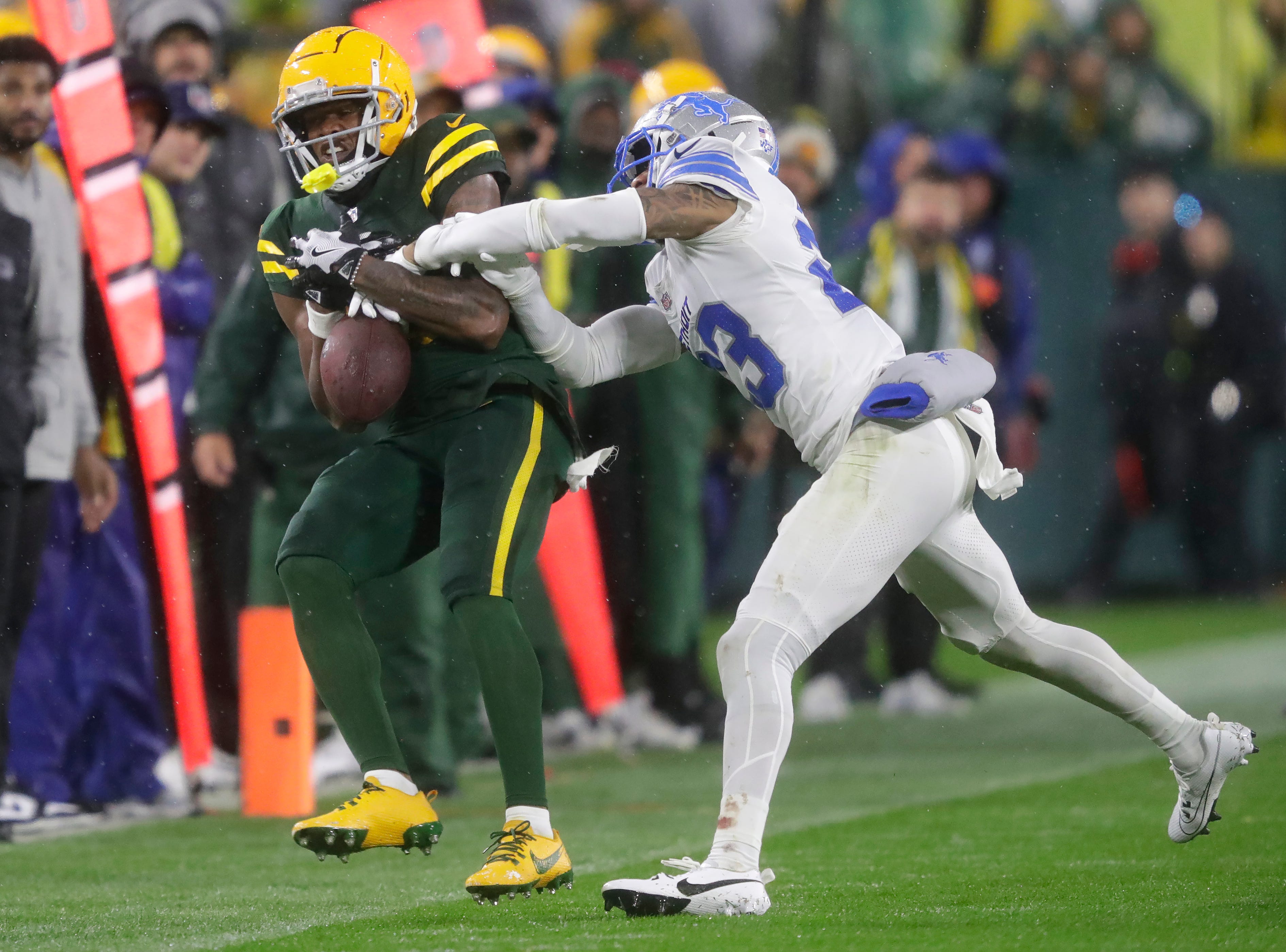Green Bay Packers wide receiver Dontayvion Wicks (13) can’t make the catch against Detroit Lions cornerback Carlton Davis III (23) during their football game Sunday, November 3, 2024, at Lambeau Field in Green Bay, Wisconsin.