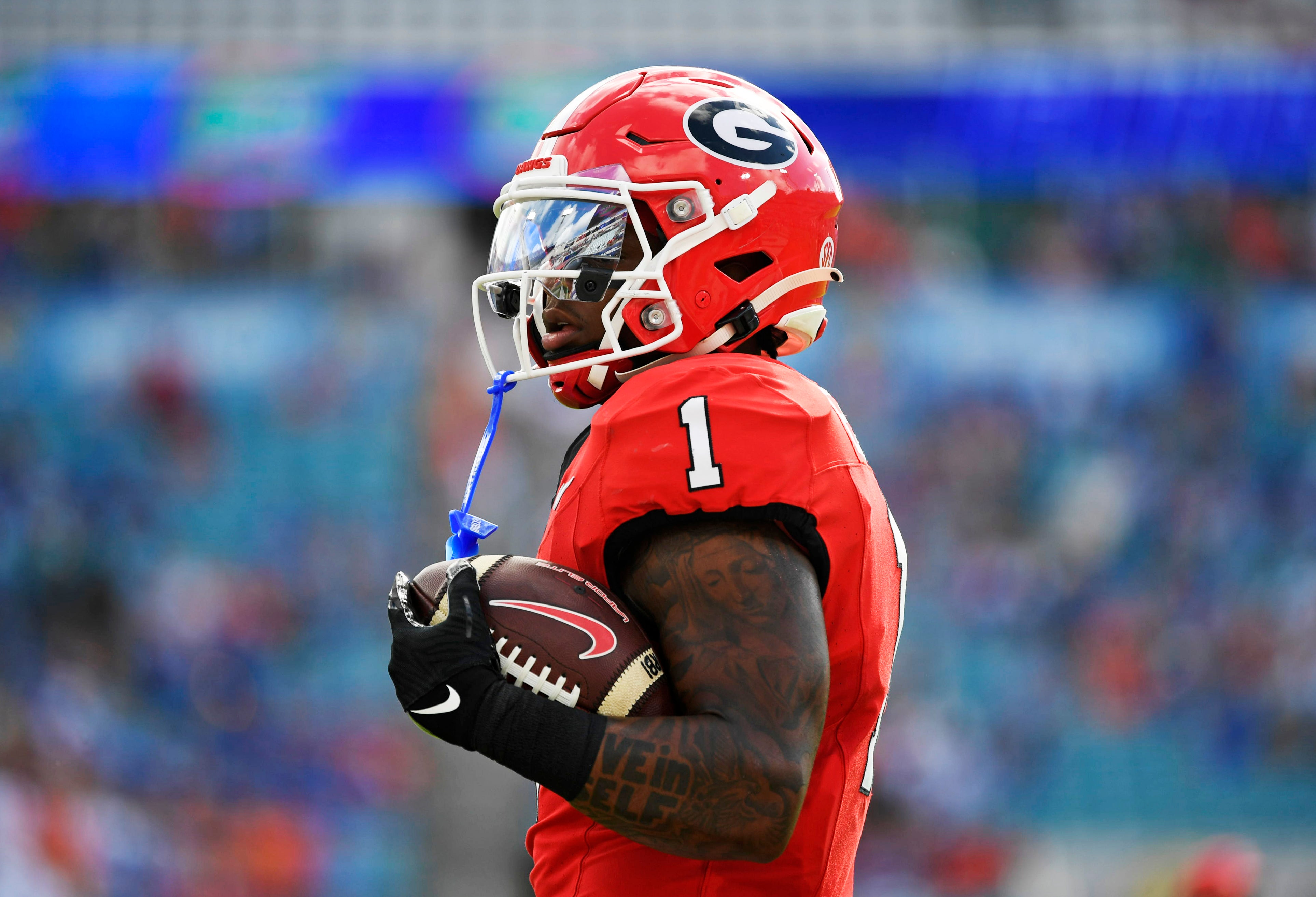 Georgia Bulldogs running back Trevor Etienne (1) warms up before a game against the Florida Gators at EverBank Stadium.