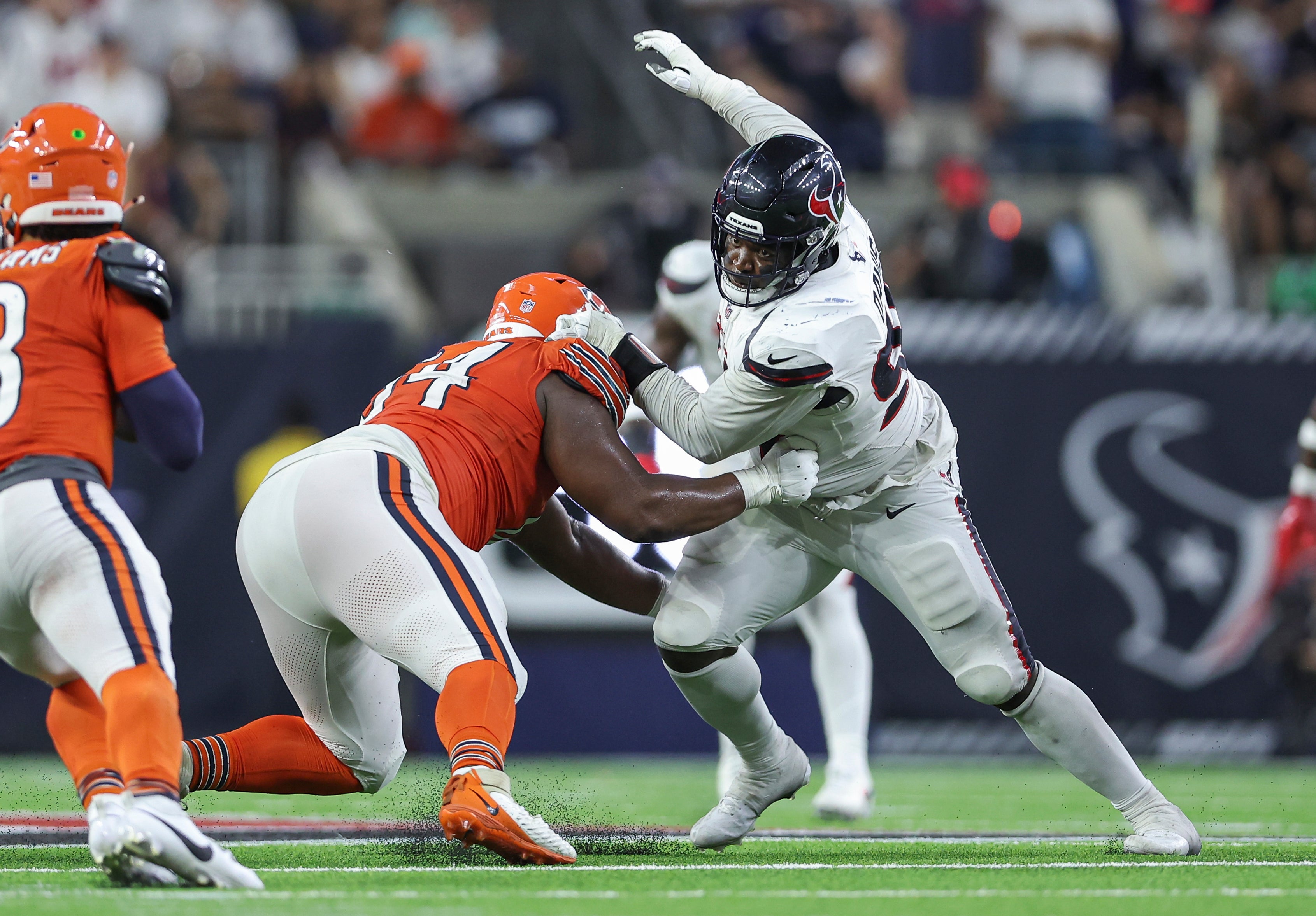 Chicago Bears guard Nate Davis (64) attempts to block Houston Texans defensive tackle Khalil Davis (94) during the game at NRG Stadium.