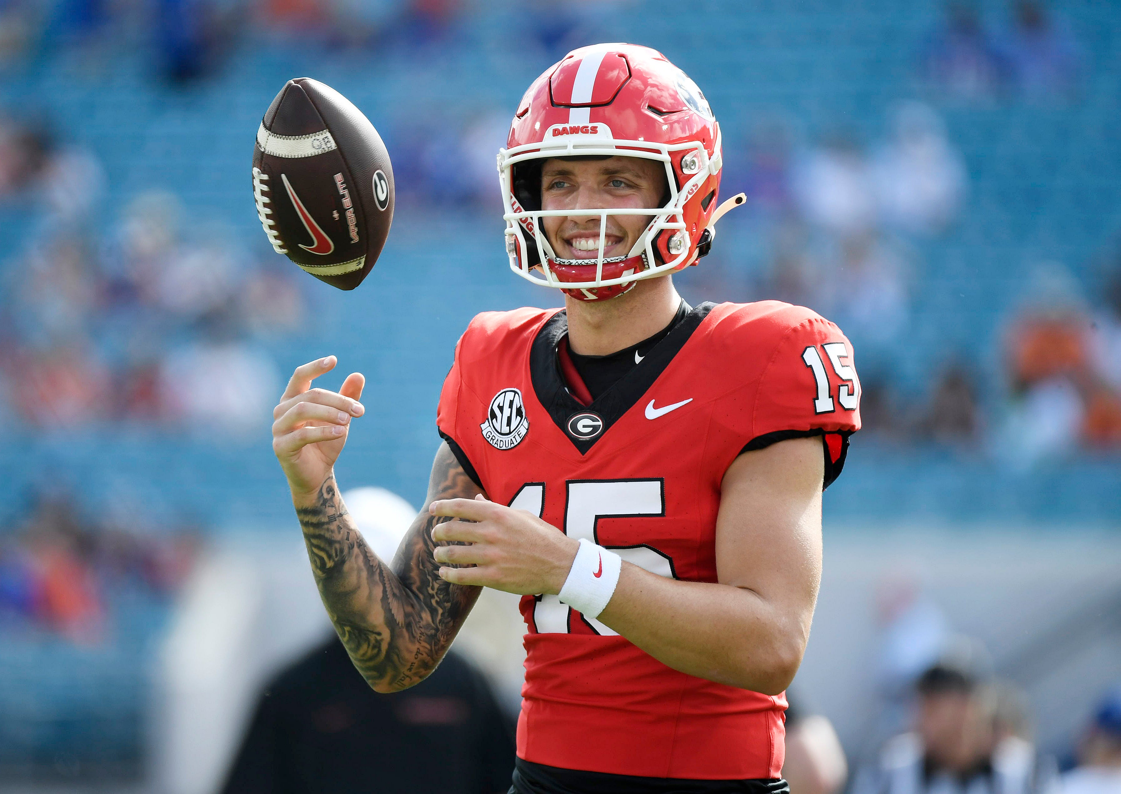 Georgia Bulldogs quarterback Carson Beck (15) warms up before a game against the Florida Gators at EverBank Stadium.