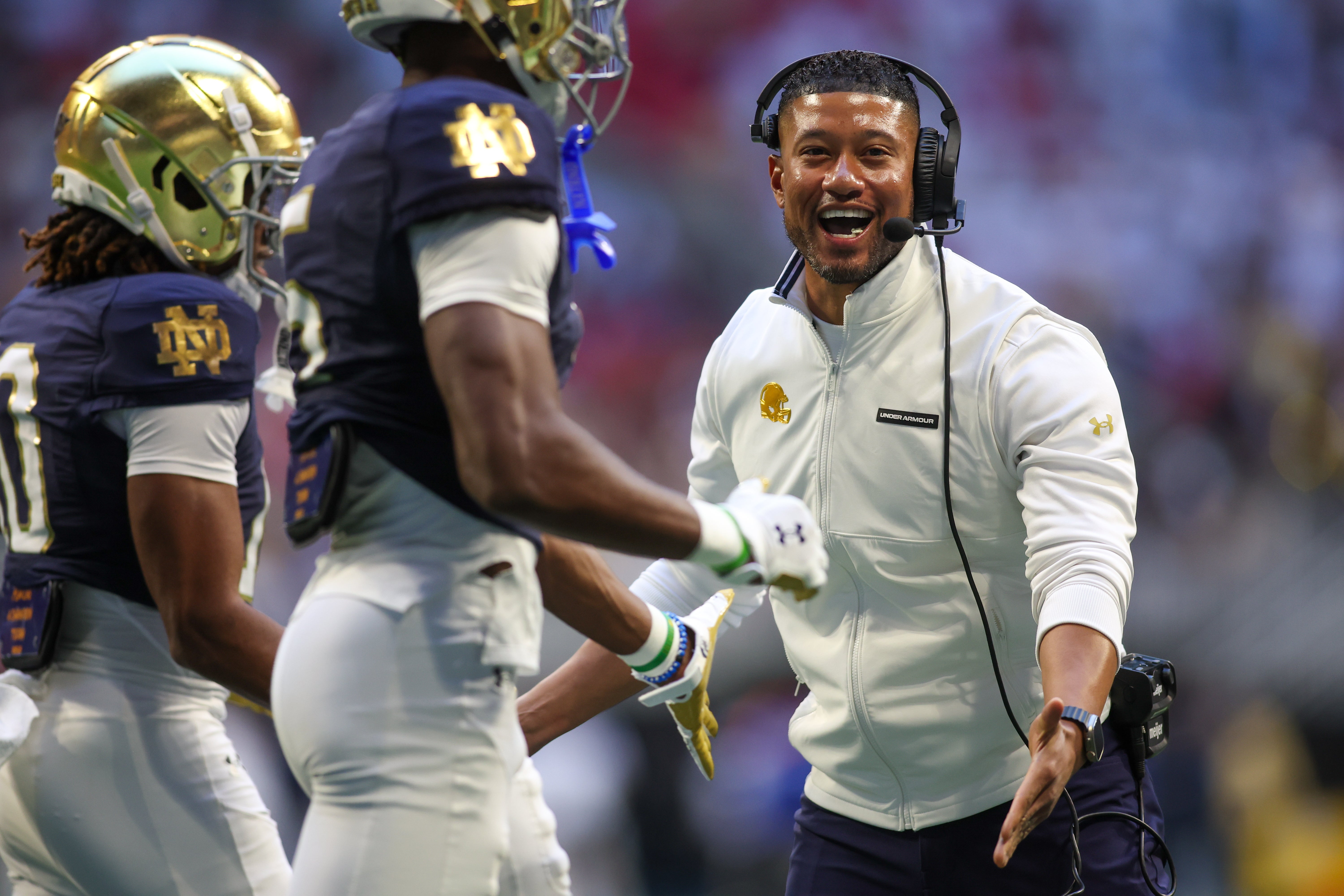 Notre Dame Fighting Irish head coach Marcus Freeman celebrates after a touchdown against the Georgia Tech Yellow Jackets in the third quarter at Mercedes-Benz Stadium.
