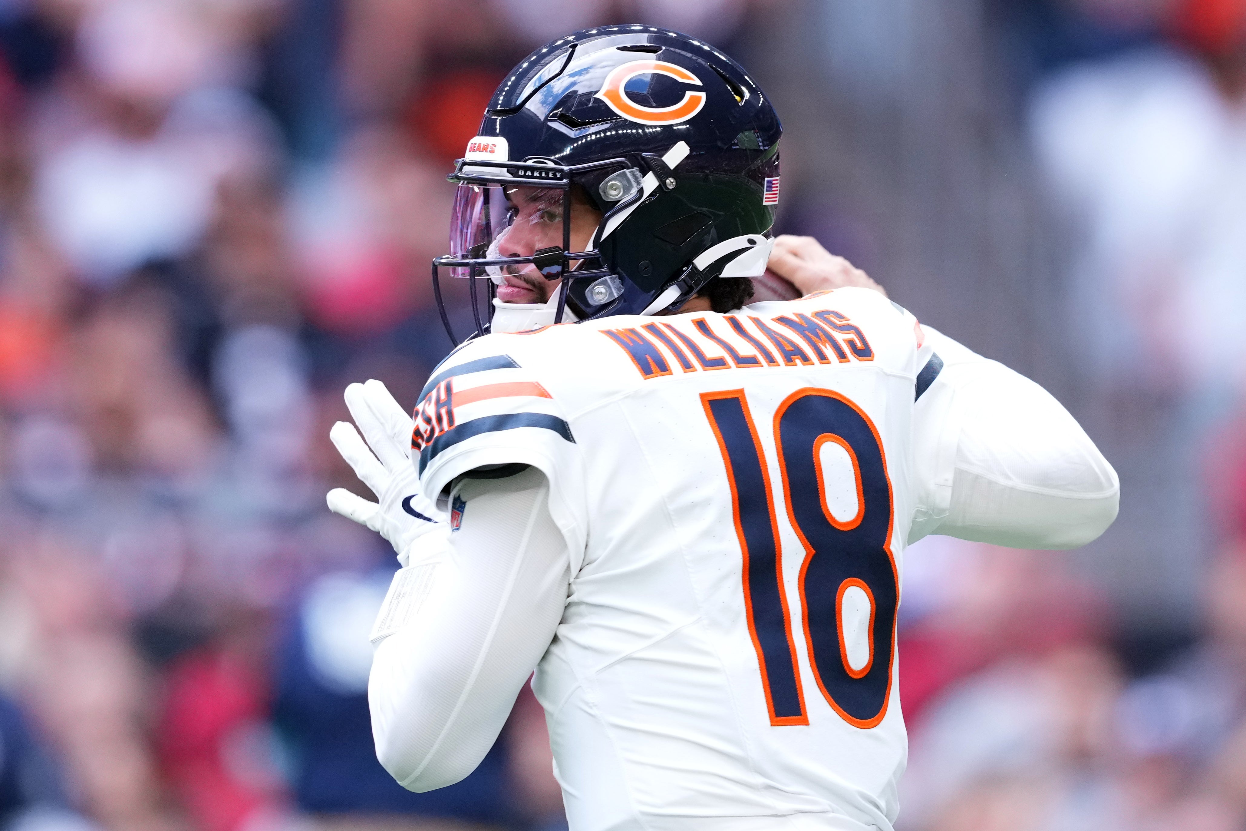Nov 3, 2024; Glendale, Arizona, USA; Chicago Bears quarterback Caleb Williams (18) passes against the Arizona Cardinals during the first half at State Farm Stadium.