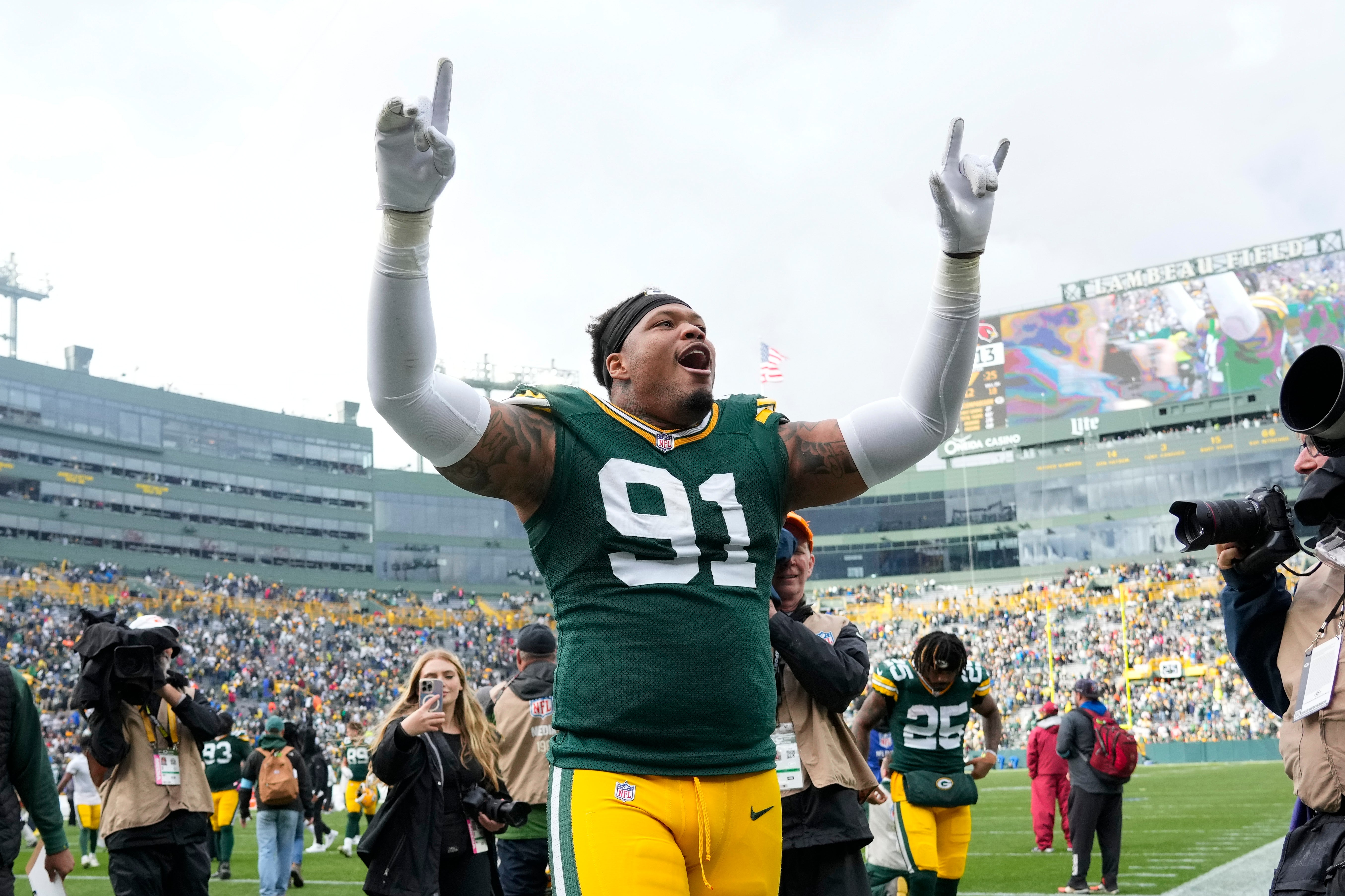 Green Bay Packers defensive lineman Preston Smith (91) celebrates following the game against the Arizona Cardinals at Lambeau Field.