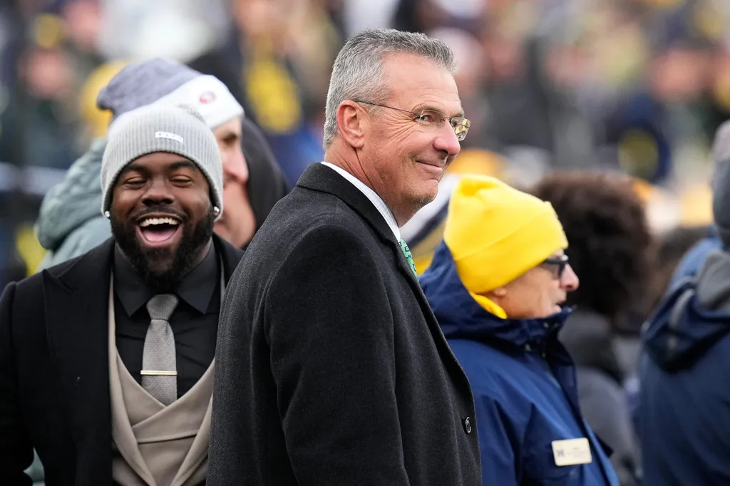 Former Ohio State Buckeyes head coach Urban Meyer watches from the sideline during the second half of the NCAA football game at Michigan Stadium. Ohio State lost to the Michigan Wolverines 30-24