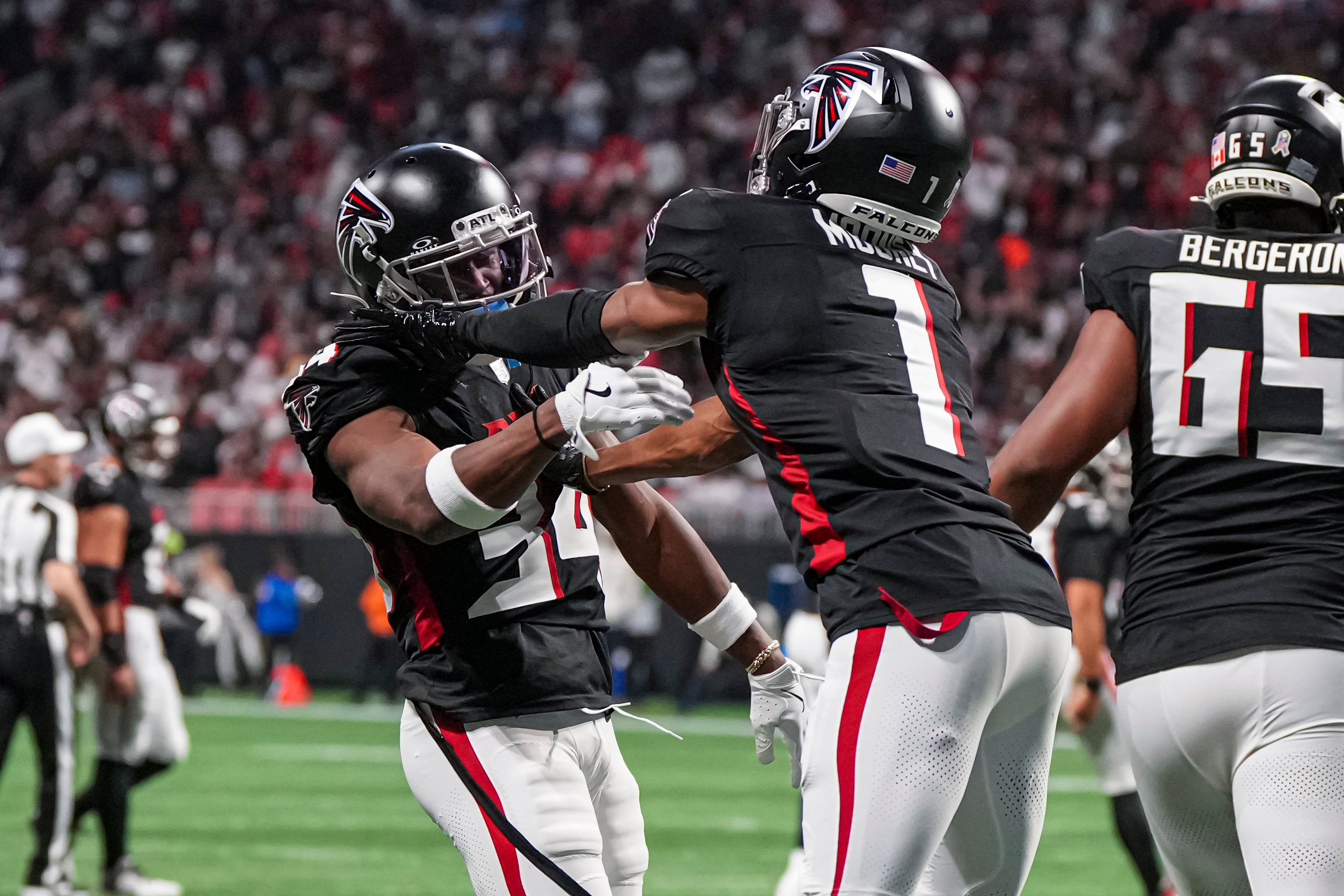 Falcons wide receiver Ray-Ray McCloud III (34) reacts with wide receiver Darnell Mooney (1) after catching a touchdown pass.