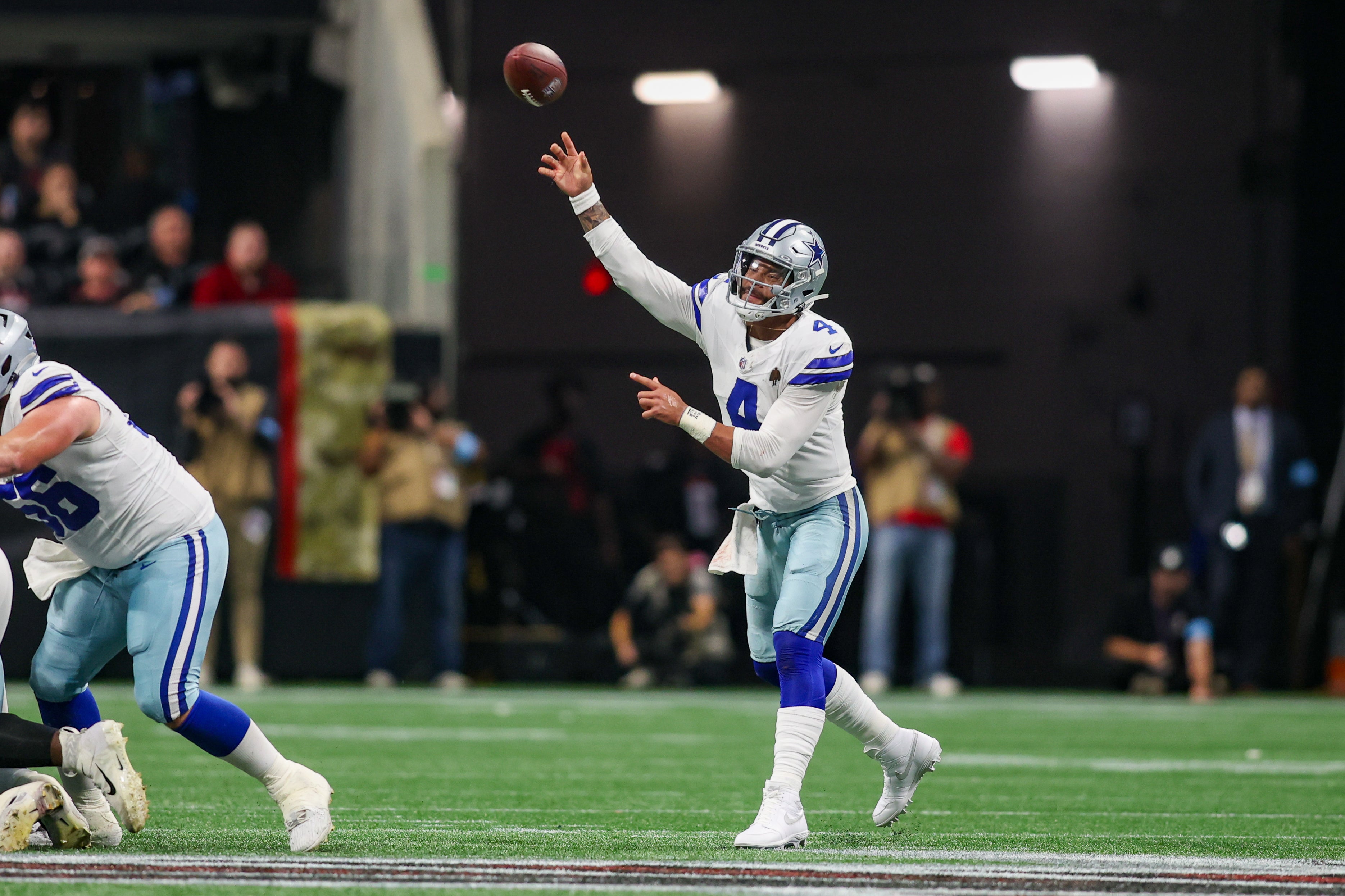 Dallas Cowboys quarterback Dak Prescott (4) throws a pass against the Atlanta Falcons in the third quarter at Mercedes-Benz Stadium.