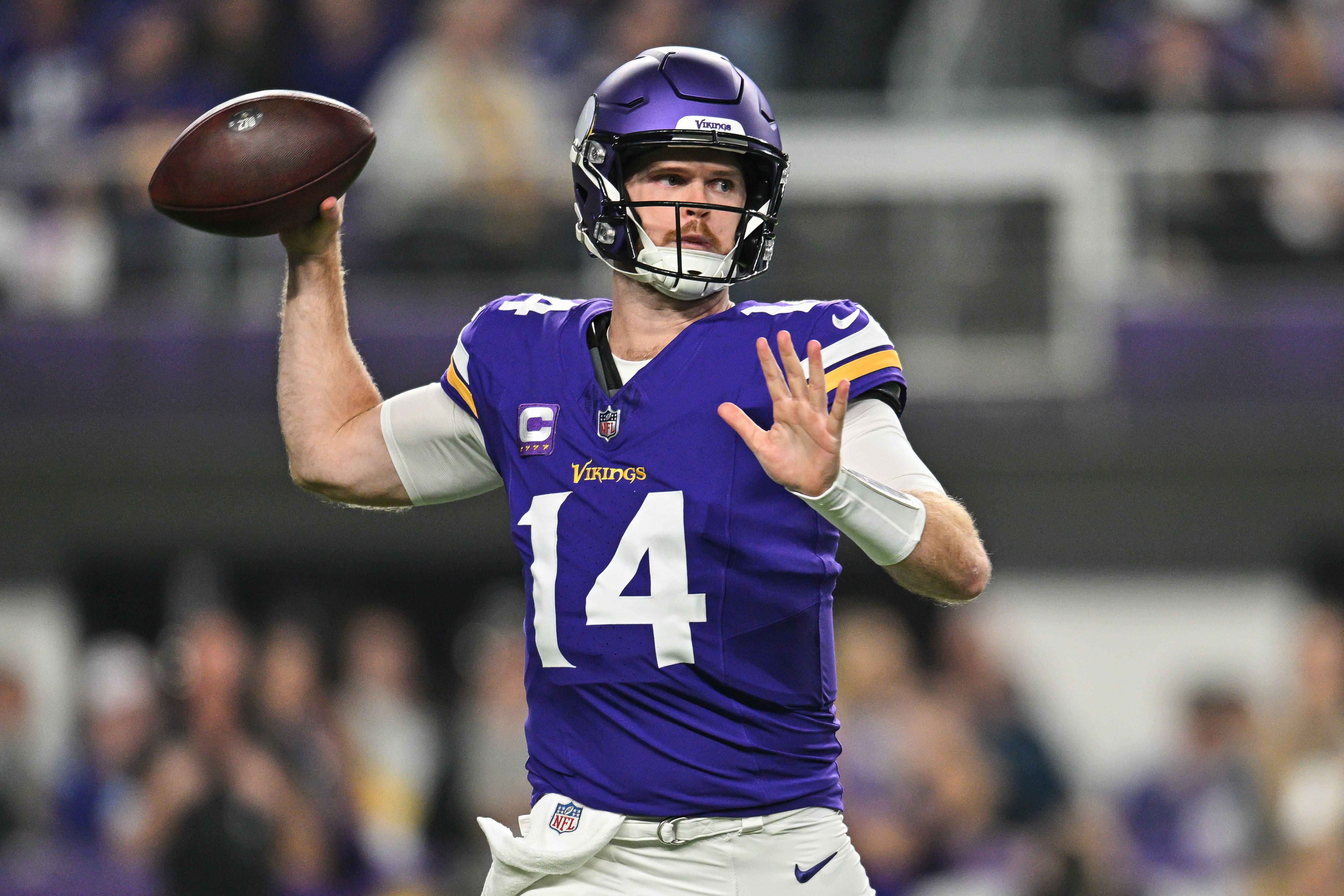 Nov 3, 2024; Minneapolis, Minnesota, USA; Minnesota Vikings quarterback Sam Darnold (14) throws a pass against the Indianapolis Colts during the first quarter at U.S. Bank Stadium.