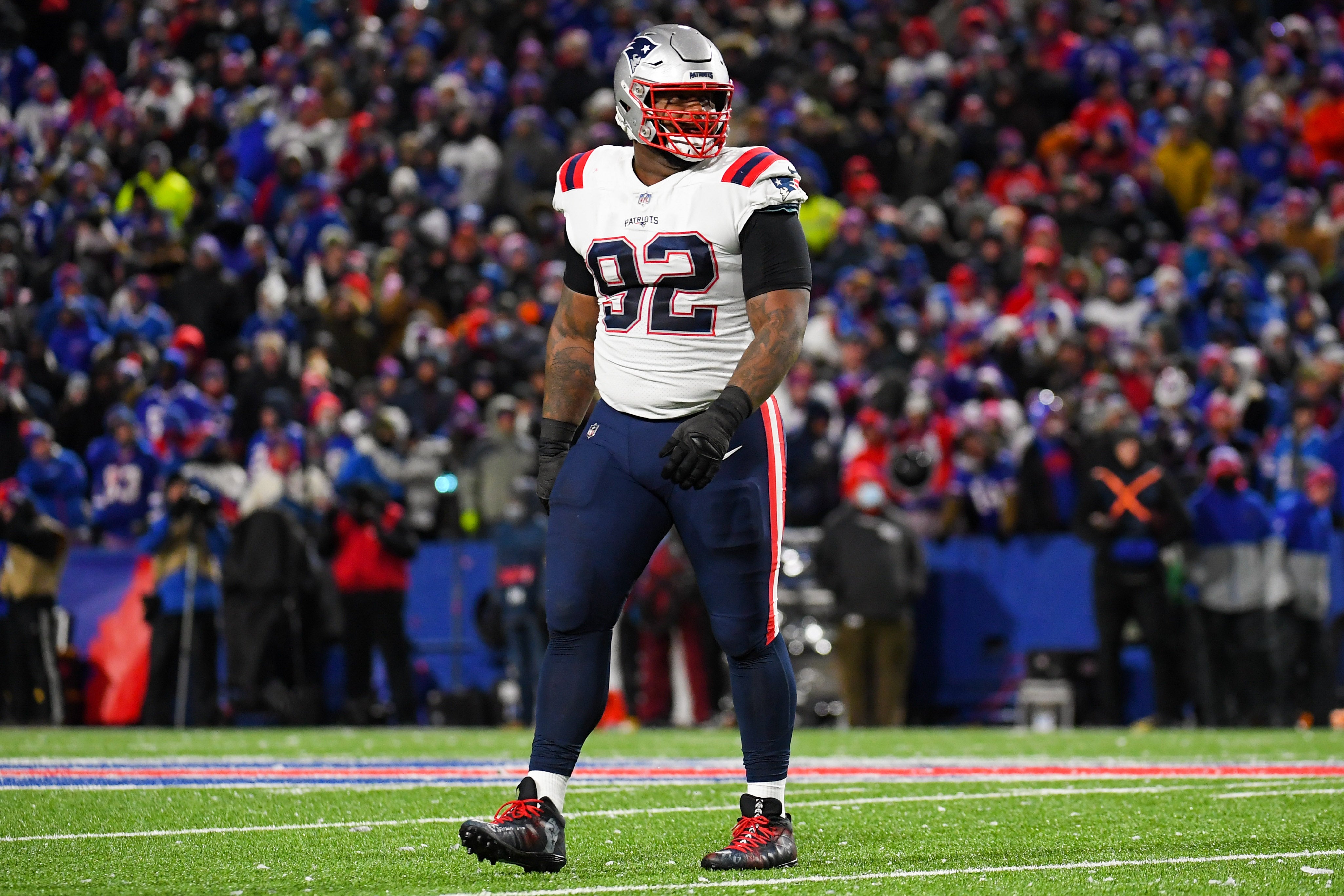 Dec 6, 2021; Orchard Park, New York, USA; New England Patriots nose tackle Davon Godchaux (92) looks on against the Buffalo Bills during the first half at Highmark Stadium.