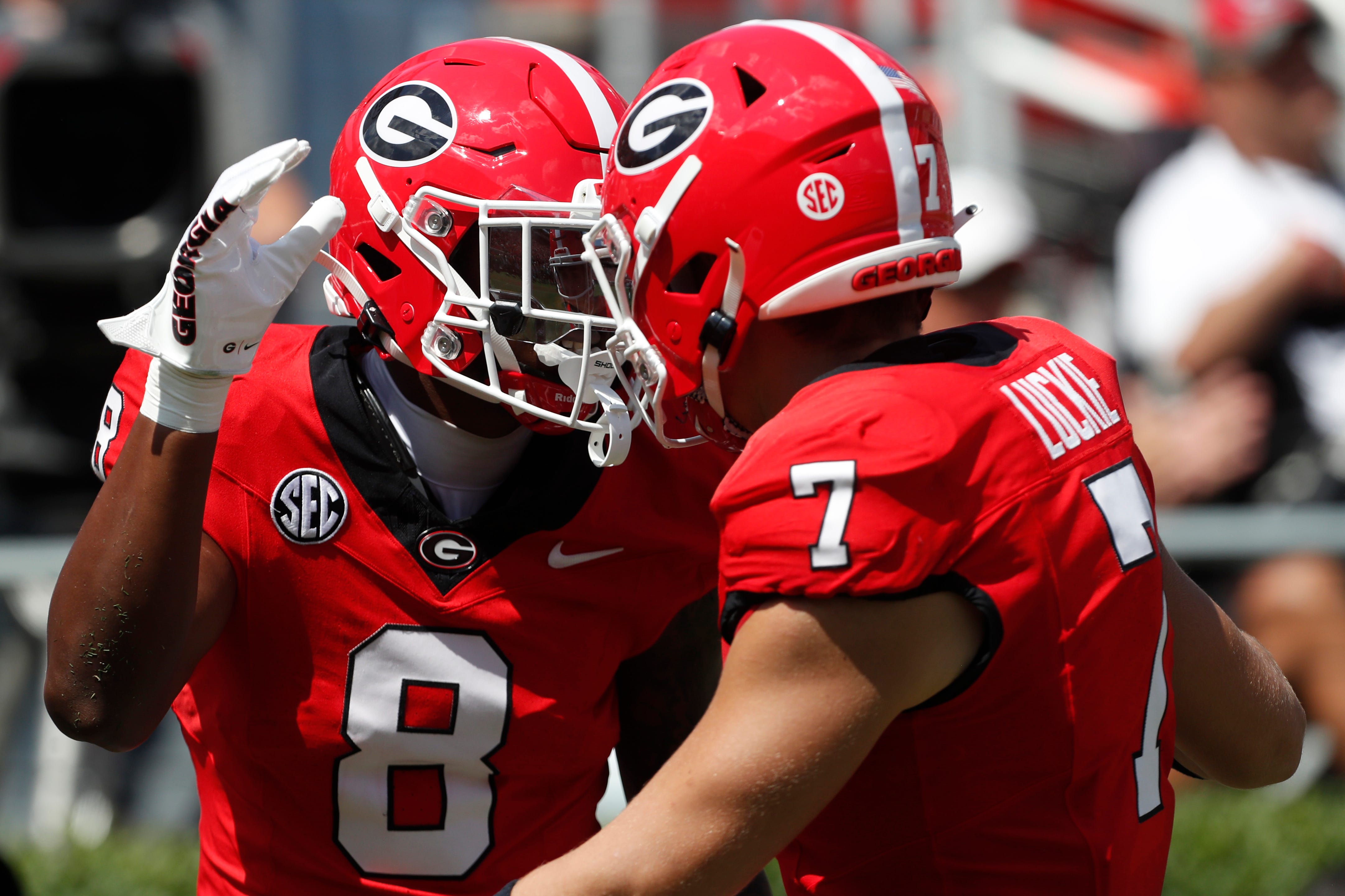 Georgia wide receiver Colbie Young (8) celebrates with Georgia tight end Lawson Luckie (7) after scoring a touchdown during the first half of a NCAA college football game against Tennessee Tech in Athens.