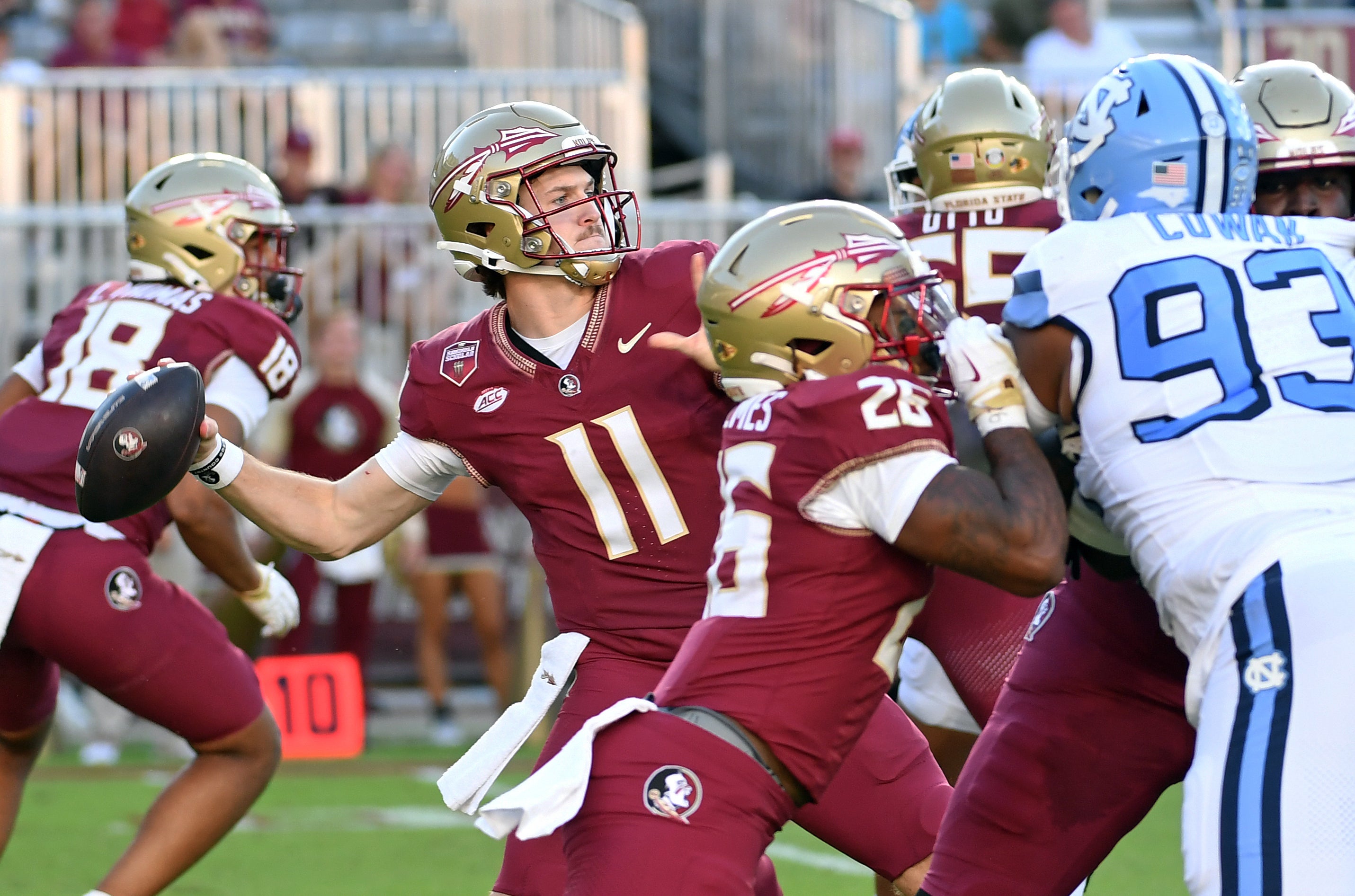 Florida State Seminoes quarterback Brock Glenn (11) throws a long completion against the North Carolina Tarheels in the third quarter at Doak S. Campbell Stadium.