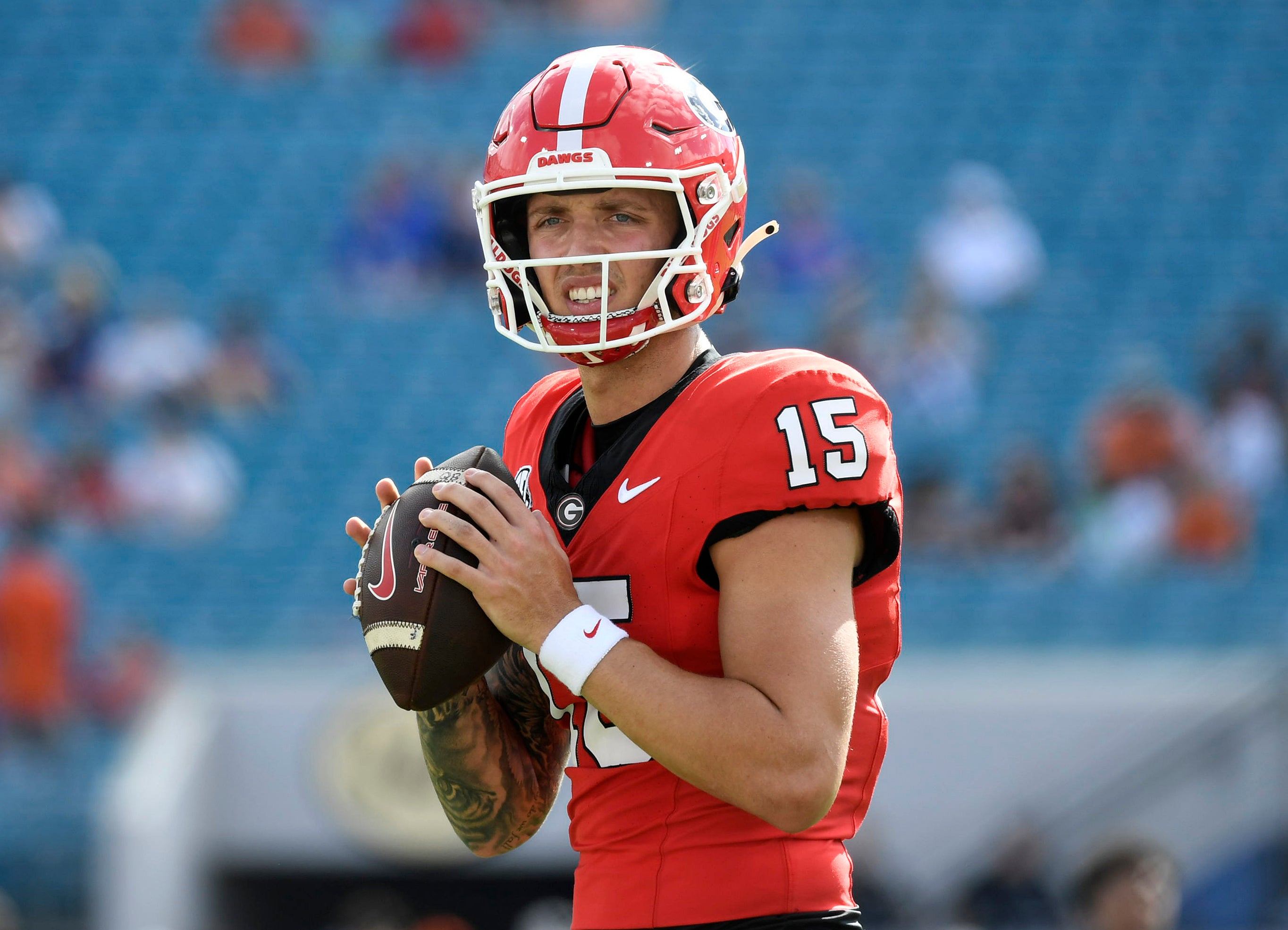 Georgia Bulldogs quarterback Carson Beck (15) warms up before a game against the Florida Gators at EverBank Stadium.