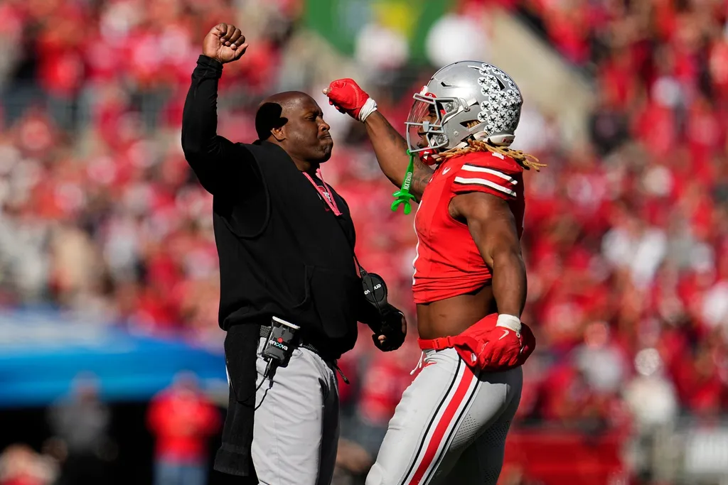 Ohio State Buckeyes running back Quinshon Judkins (1) celebrates a touchdown with running backs coach Carlos Locklyn during the second half of the NCAA football game against the Nebraska Cornhuskers