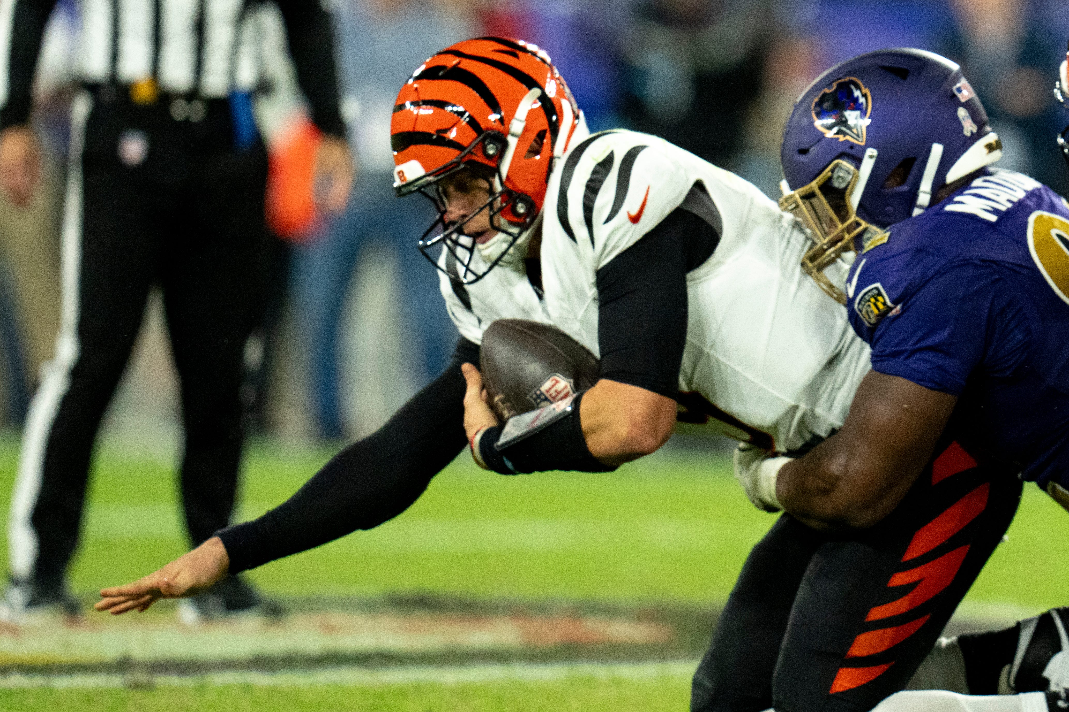 Baltimore Ravens defensive tackle Nnamdi Madubuike (92) tackles Cincinnati Bengals quarterback Joe Burrow (9) in the third quarter of the NFL game at M&T Banks Stadium in Baltimore on Thursday, Nov. 7, 2024.  