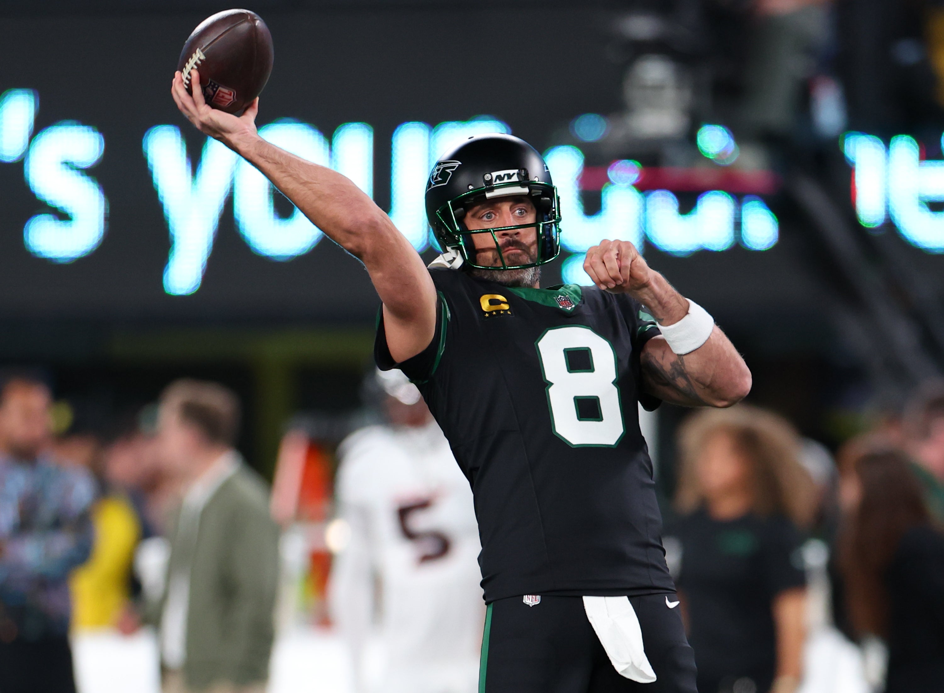 New York Jets quarterback Aaron Rodgers (8) throws a pass during pregame warmups for their game against the Houston Texans at MetLife Stadium.
