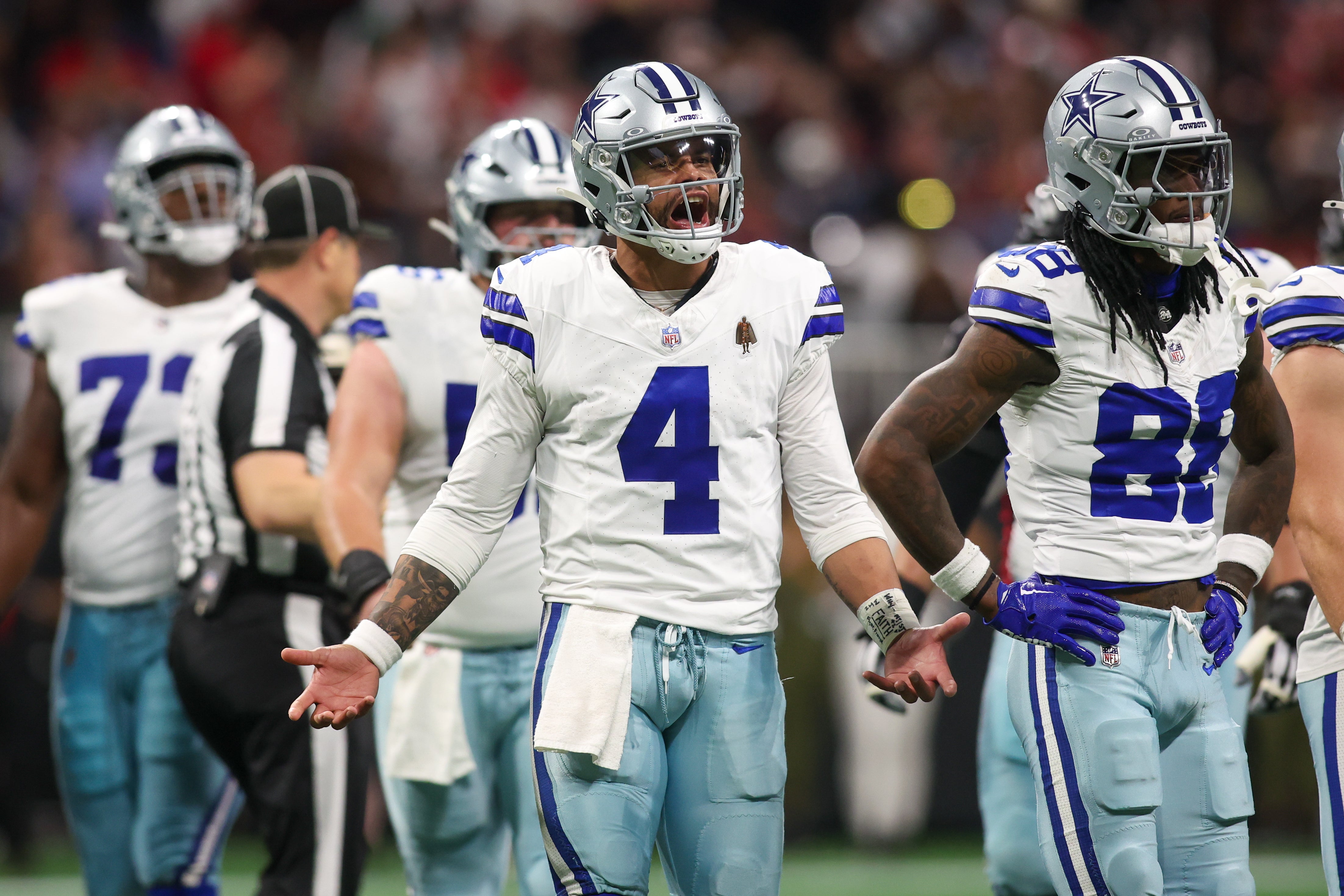 Dallas Cowboys quarterback Dak Prescott (4) reacts to a penalty against the Atlanta Falcons in the third quarter at Mercedes-Benz Stadium.