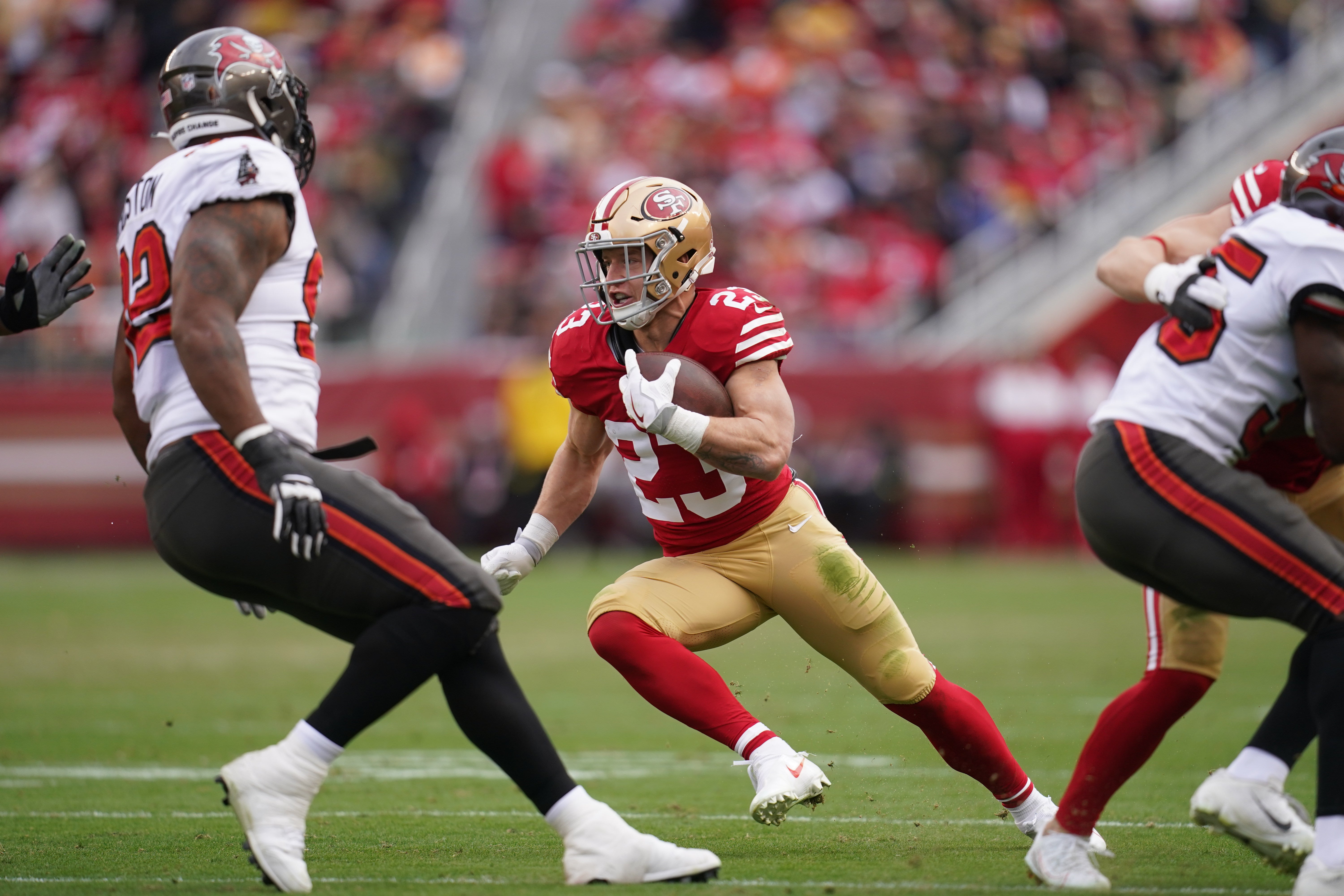 Dec 11, 2022; Santa Clara, California, USA; San Francisco 49ers running back Christian McCaffrey (23) runs the ball against the Tampa Bay Buccaneers in the first quarter at Levi's Stadium.