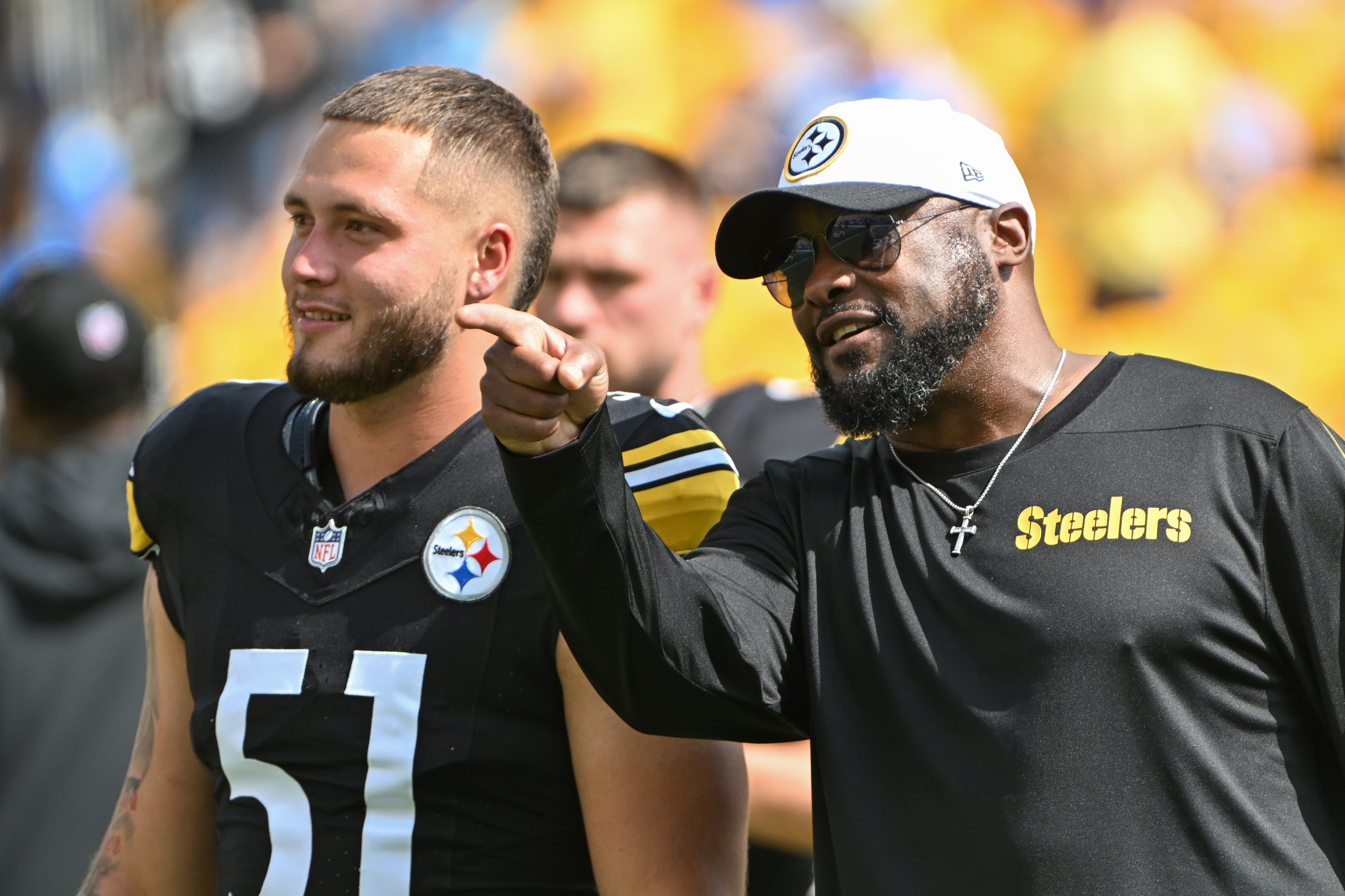 Sep 22, 2024; Pittsburgh, Pennsylvania, USA; Pittsburgh Steelers head coach Mike Tomlin talks with linebacker Nick Herbig (51) before a game against the Los Angeles Chargers at Acrisure Stadium.