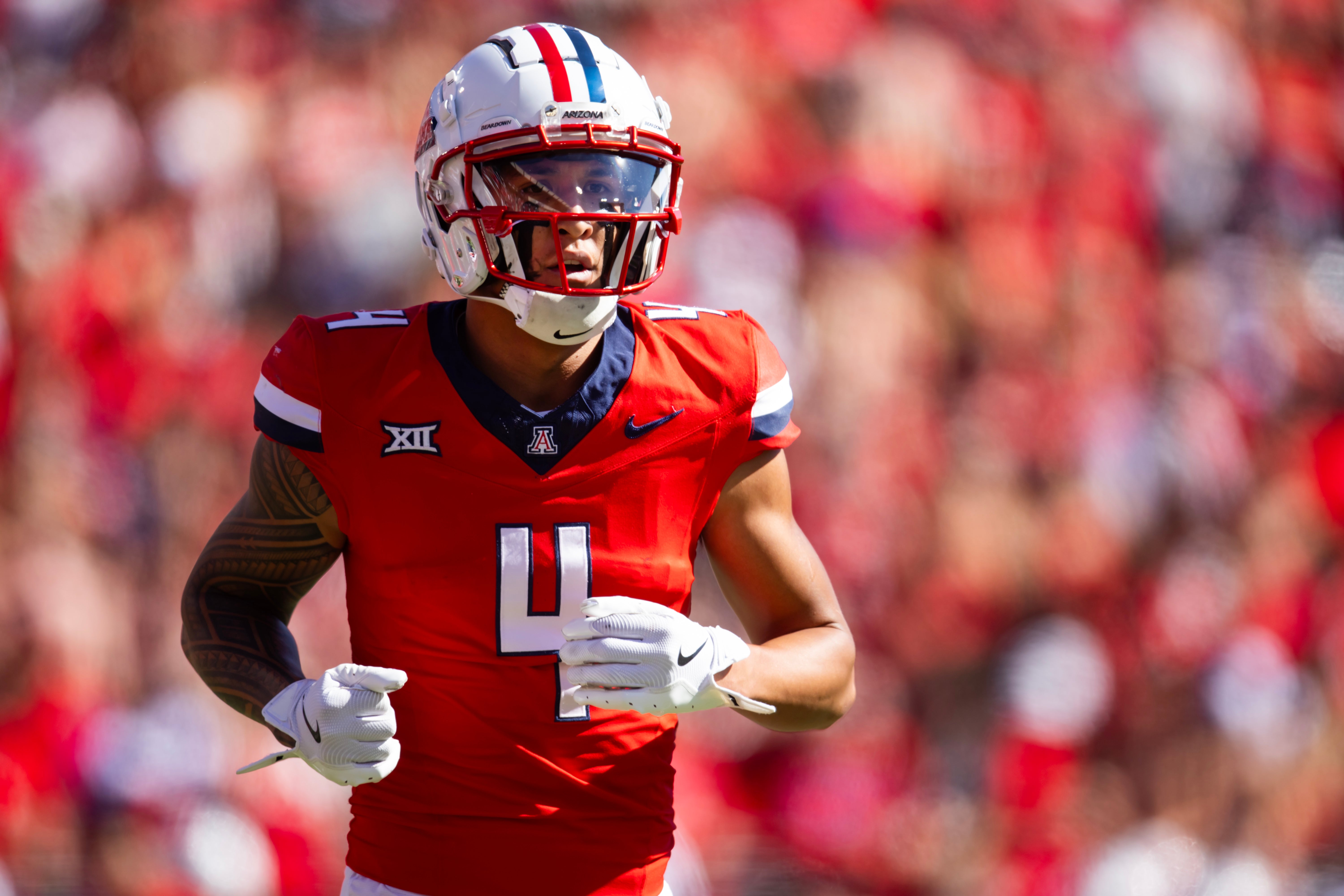 Oct 19, 2024; Tucson, Arizona, USA; Arizona Wildcats wide receiver Tetairoa McMillan (4) against the Colorado Buffalos at Arizona Stadium.