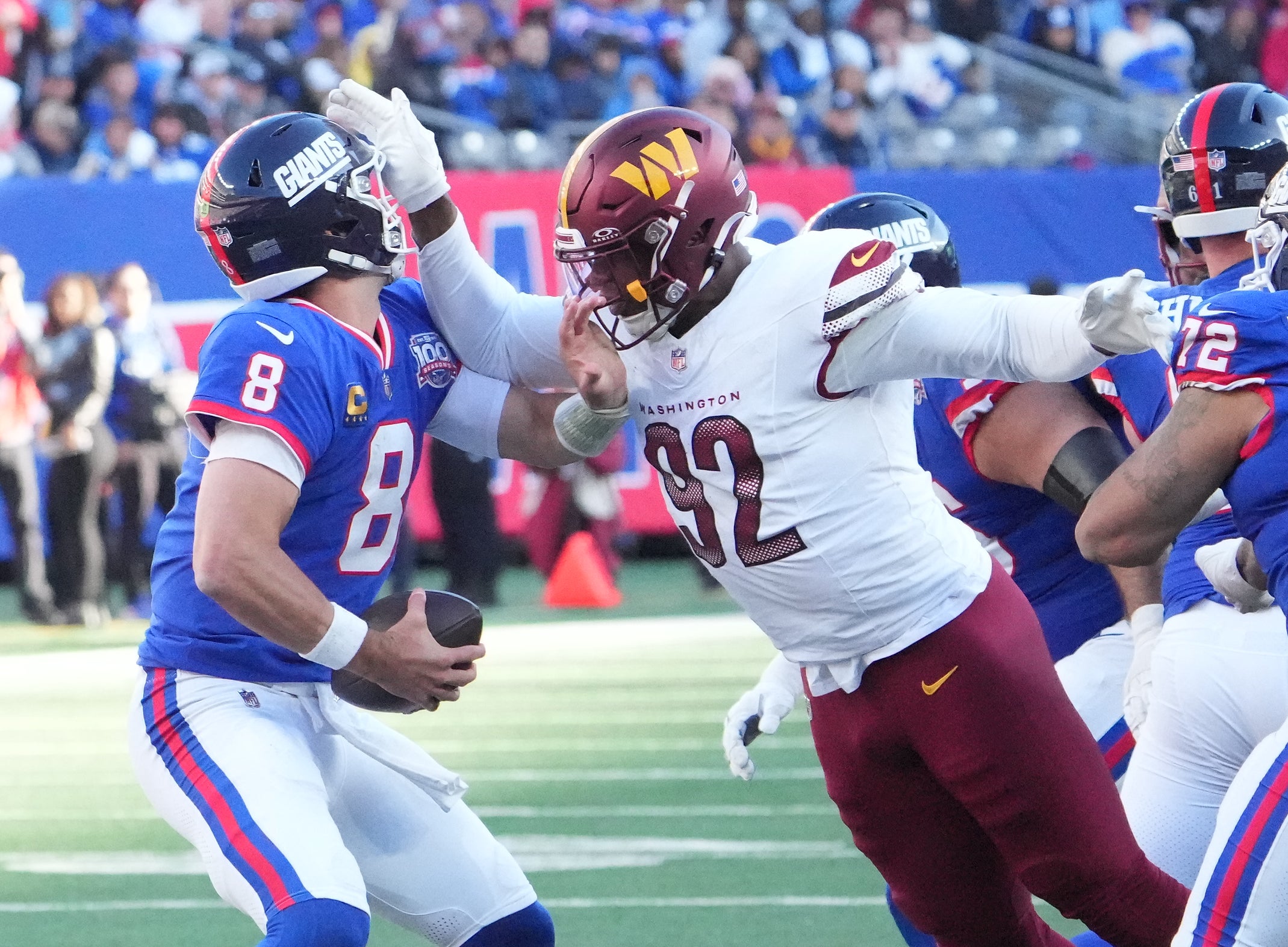 Nov 3, 2024; East Rutherford, New Jersey, USA; Washington Commanders defensive end Dorance Armstrong (92) is called for a personal foul while trying to sack New York Giants quarterback Daniel Jones (8) in the 2nd half at MetLife Stadium.