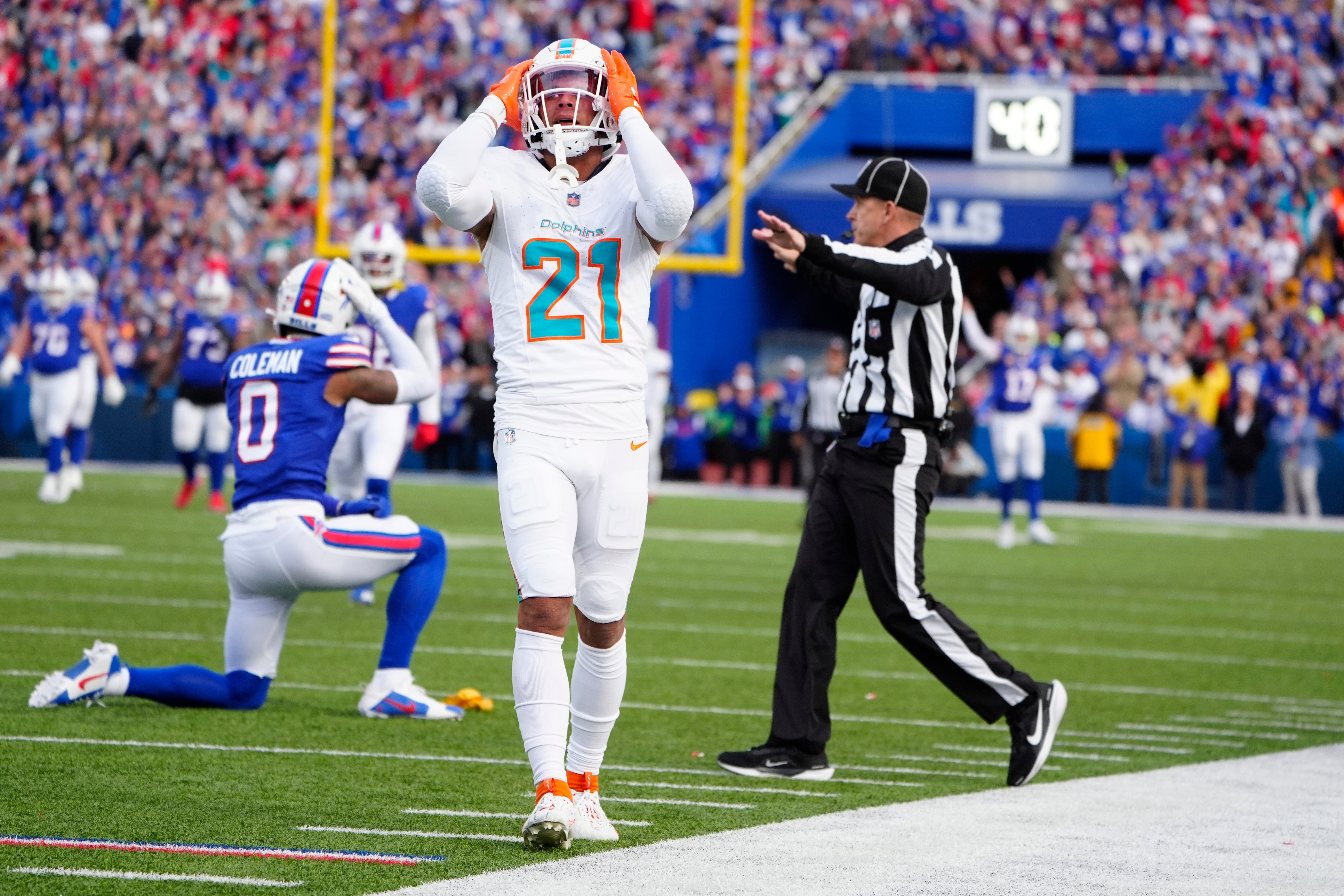 Miami Dolphins safety Jordan Poyer (21) reacts to getting penalized on a a hit against Buffalo Bills wide receiver Keon Coleman (0) during the second half at Highmark Stadium.