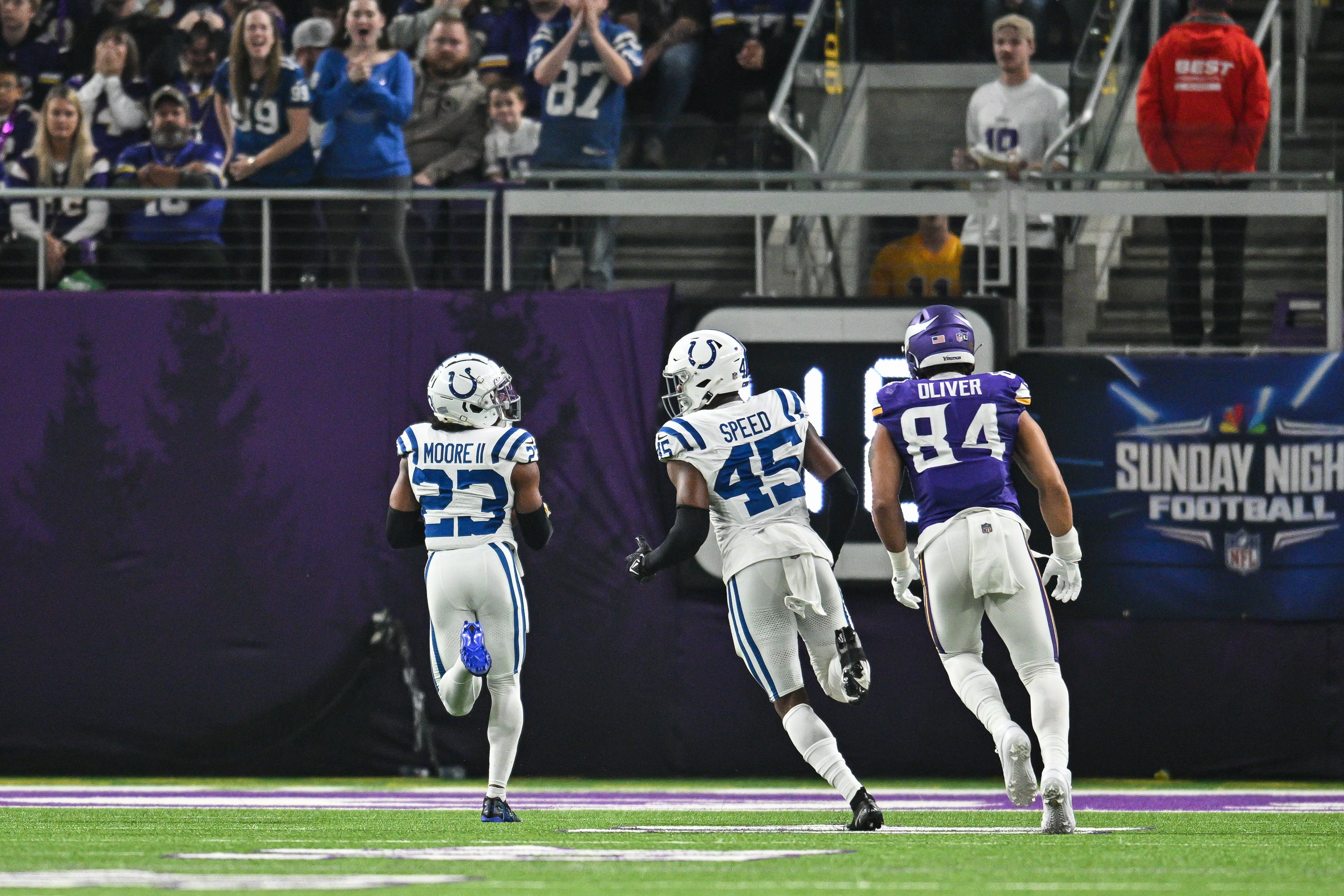 Nov 3, 2024; Minneapolis, Minnesota, USA; Indianapolis Colts cornerback Kenny Moore II (23) returns a fumble for a touchdown as Minnesota Vikings tight end Josh Oliver (84) pursues as linebacker E.J. Speed (45) looks on during the second quarter at U.S. Bank Stadium.