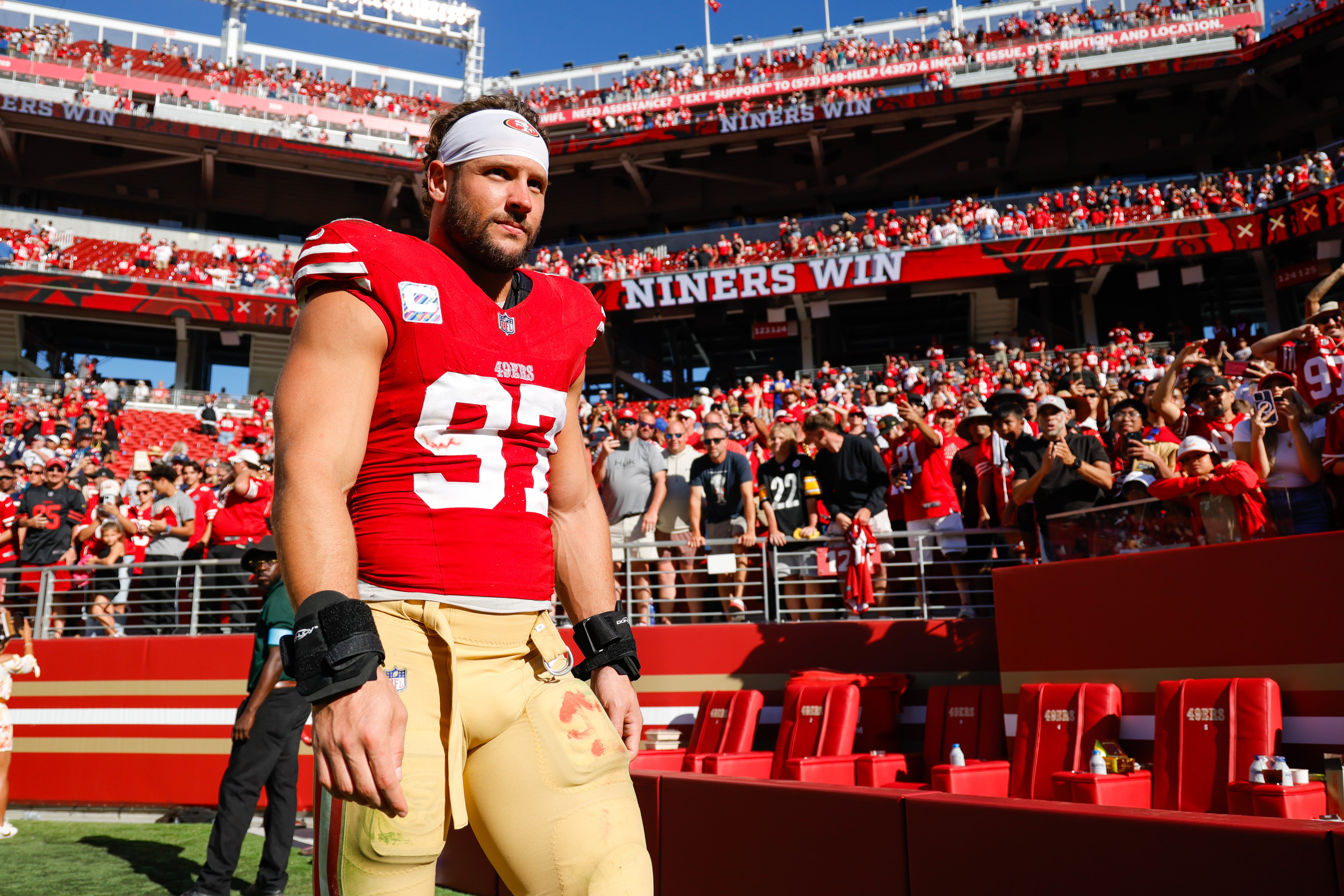 San Francisco 49ers defensive end Nick Bosa (97) walks off the field after the game against the New England Patriots at Levi's Stadium.