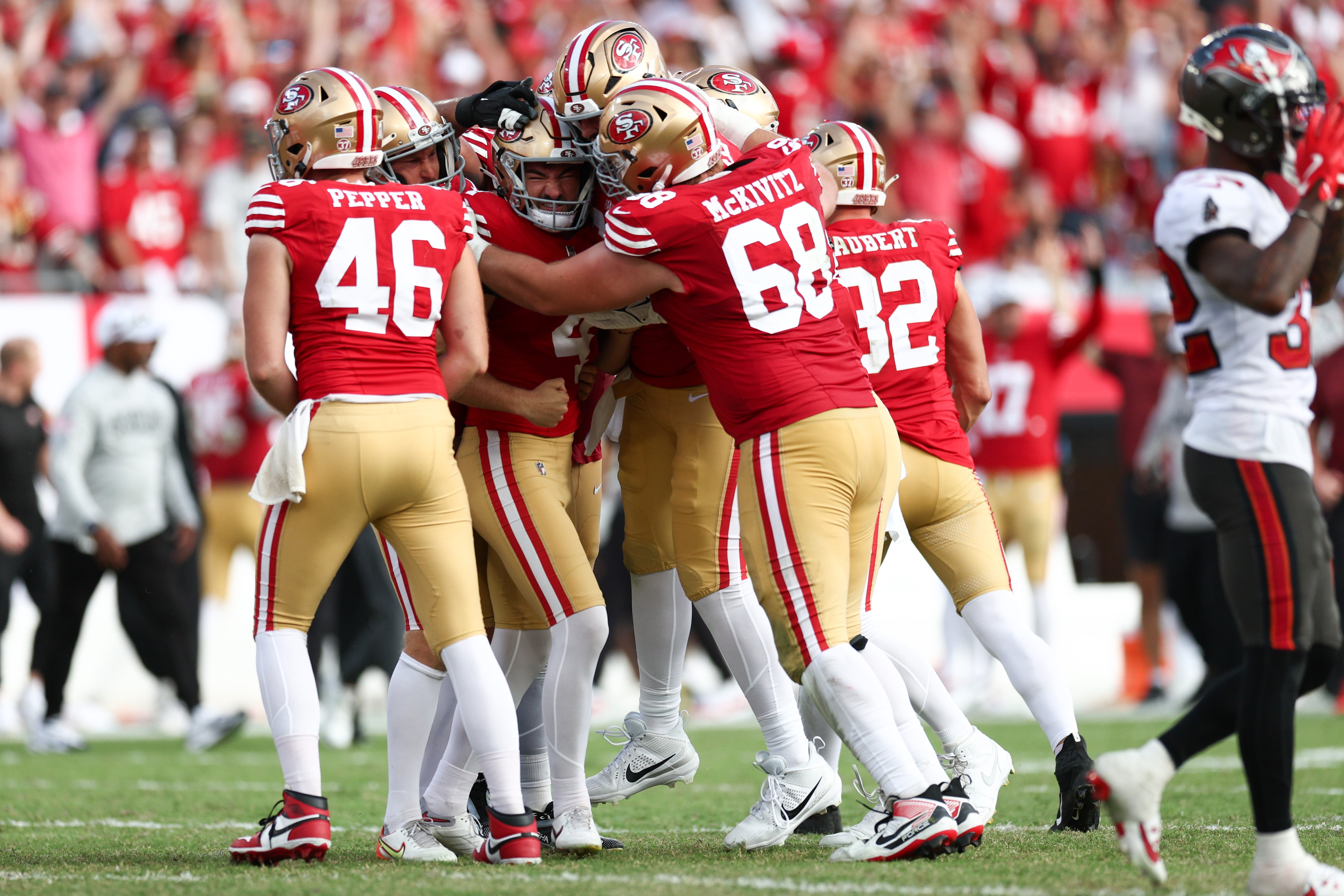 San Francisco 49ers place kicker Jake Moody (4) celebrates after kicking a game winning field goal against the Tampa Bay Buccaneers in the fourth quarter at Raymond James Stadium.