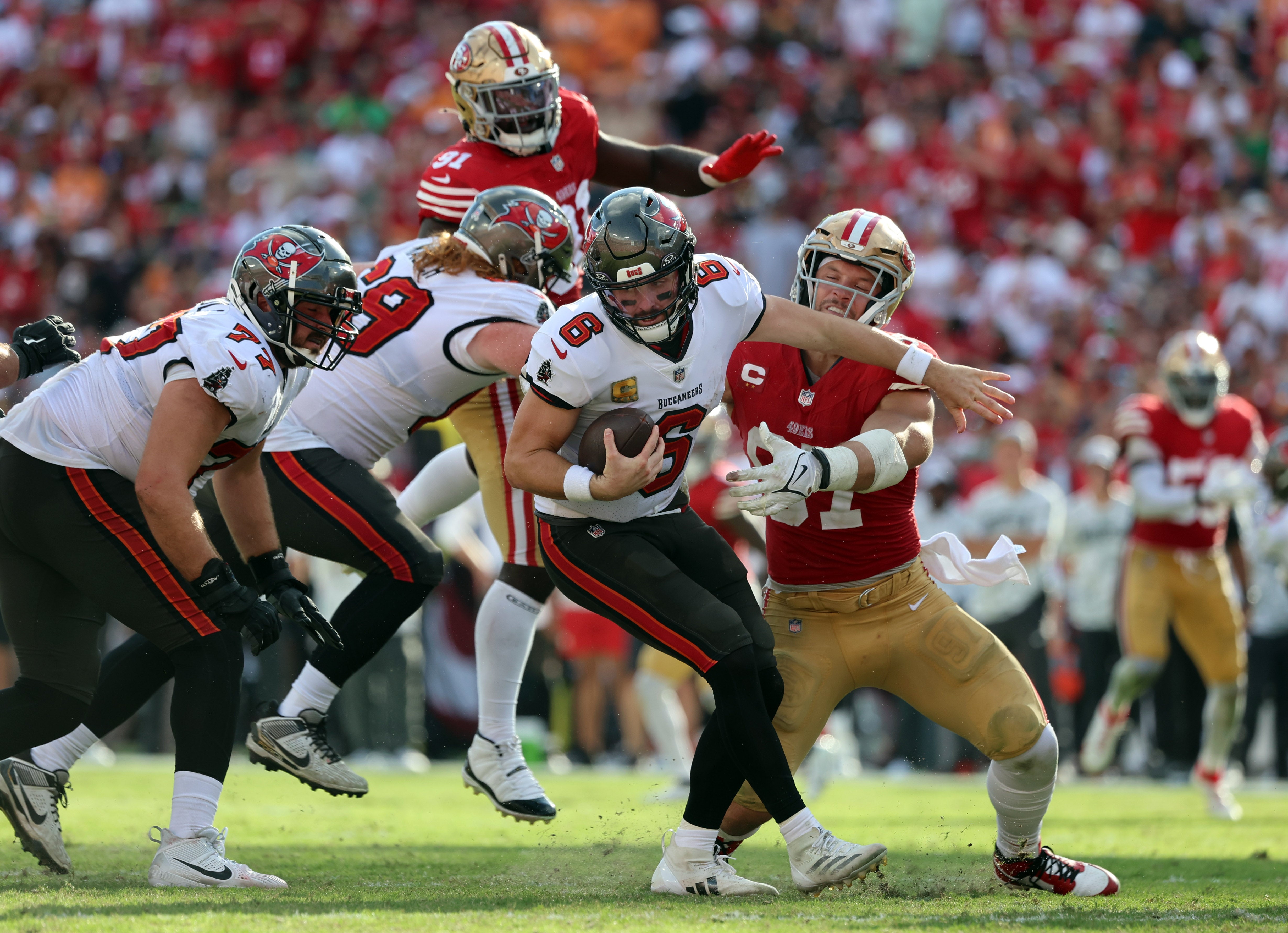 San Francisco 49ers defensive end Nick Bosa (97) sacks Tampa Bay Buccaneers quarterback Baker Mayfield (6) during the second half at Raymond James Stadium.