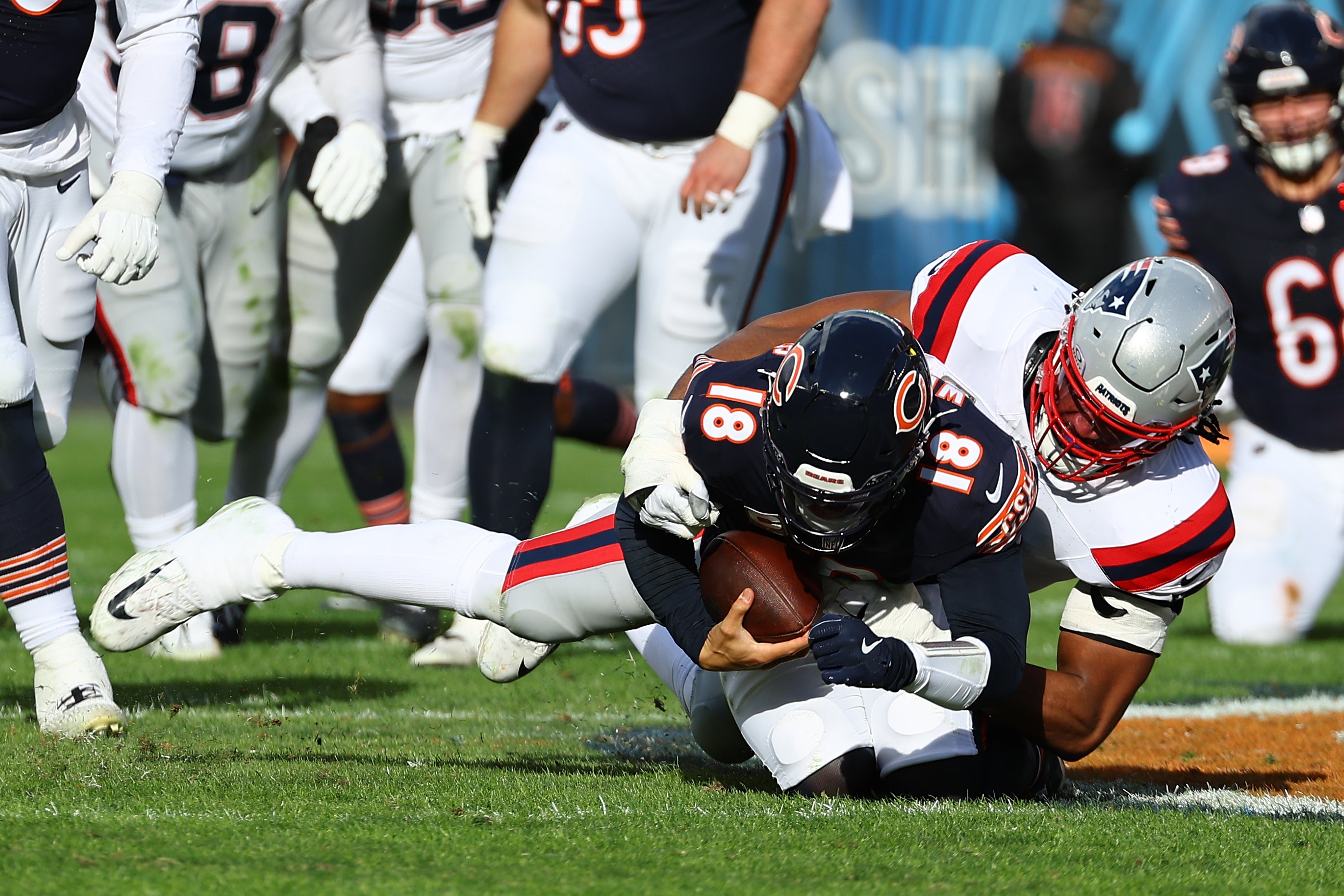Nov 10, 2024; Chicago, Illinois, USA; New England Patriots defensive end Deatrich Wise Jr. (91) sacks Chicago Bears quarterback Caleb Williams (18) during the second half at Soldier Field.