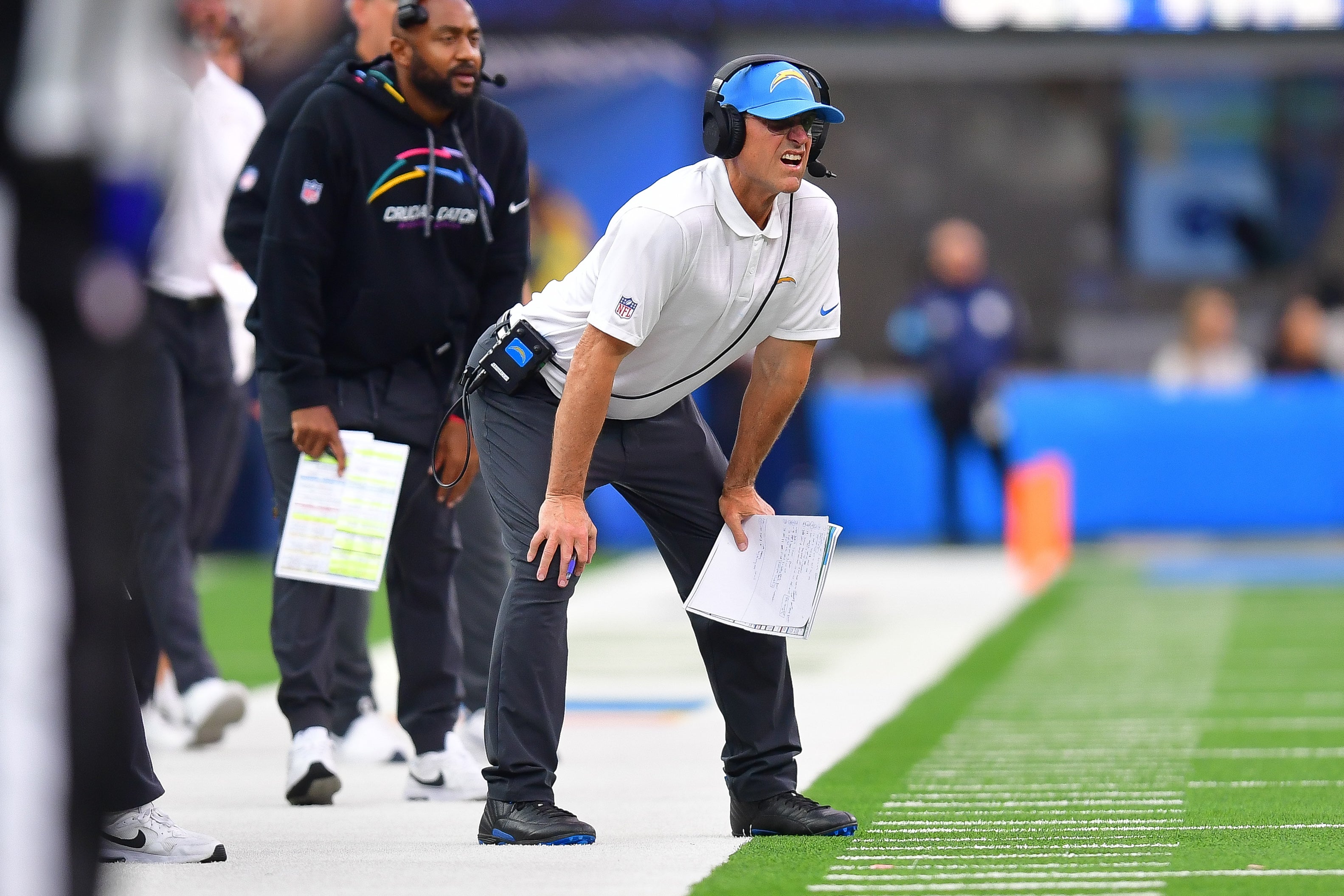Oct 27, 2024; Inglewood, California, USA; Los Angeles Chargers head coach Jim Harbaugh watches game action against the New Orleans Saints during the second half at SoFi Stadium. Mandatory Credit: Gary A. Vasquez-Imagn Images