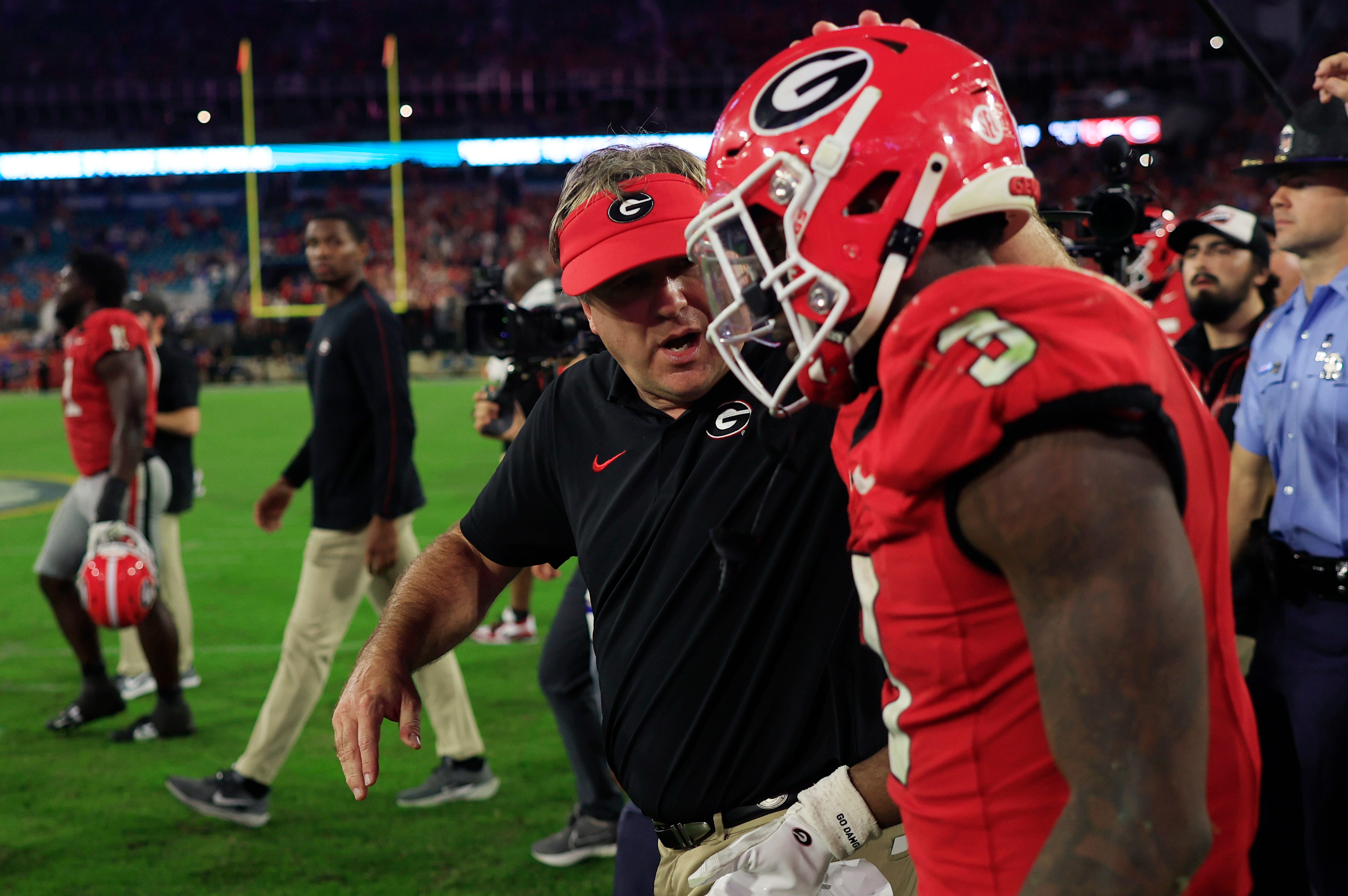 Georgia Bulldogs head coach Kirby Smart talks with running back Nate Frazier (3) after the game of an NCAA college football matchup Saturday, Nov. 2, 2024 at EverBank Stadium in Jacksonville, Fla.