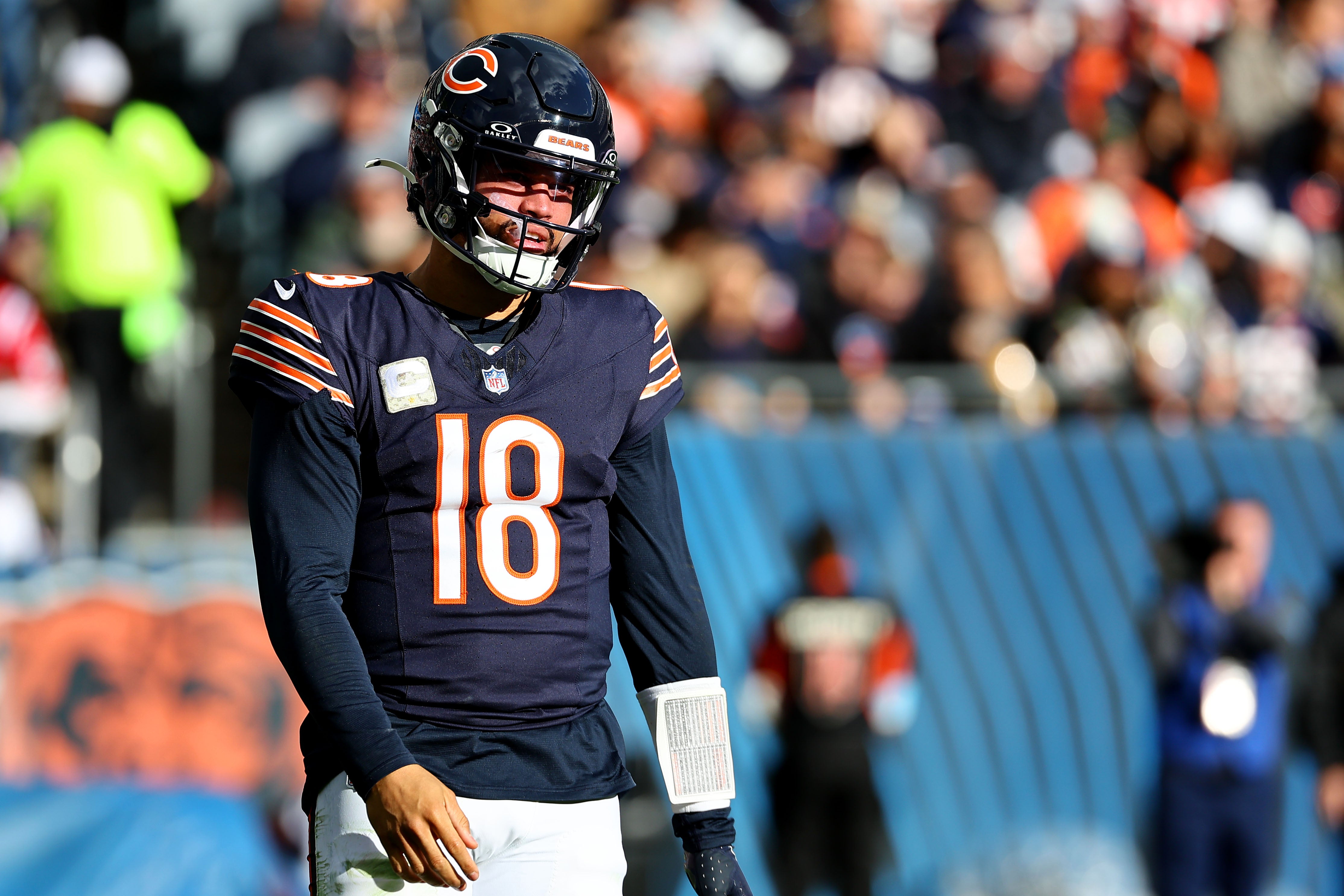 Nov 10, 2024; Chicago, Illinois, USA; Chicago Bears quarterback Caleb Williams (18) reacts after a pass against the New England Patriots during the second half at Soldier Field.