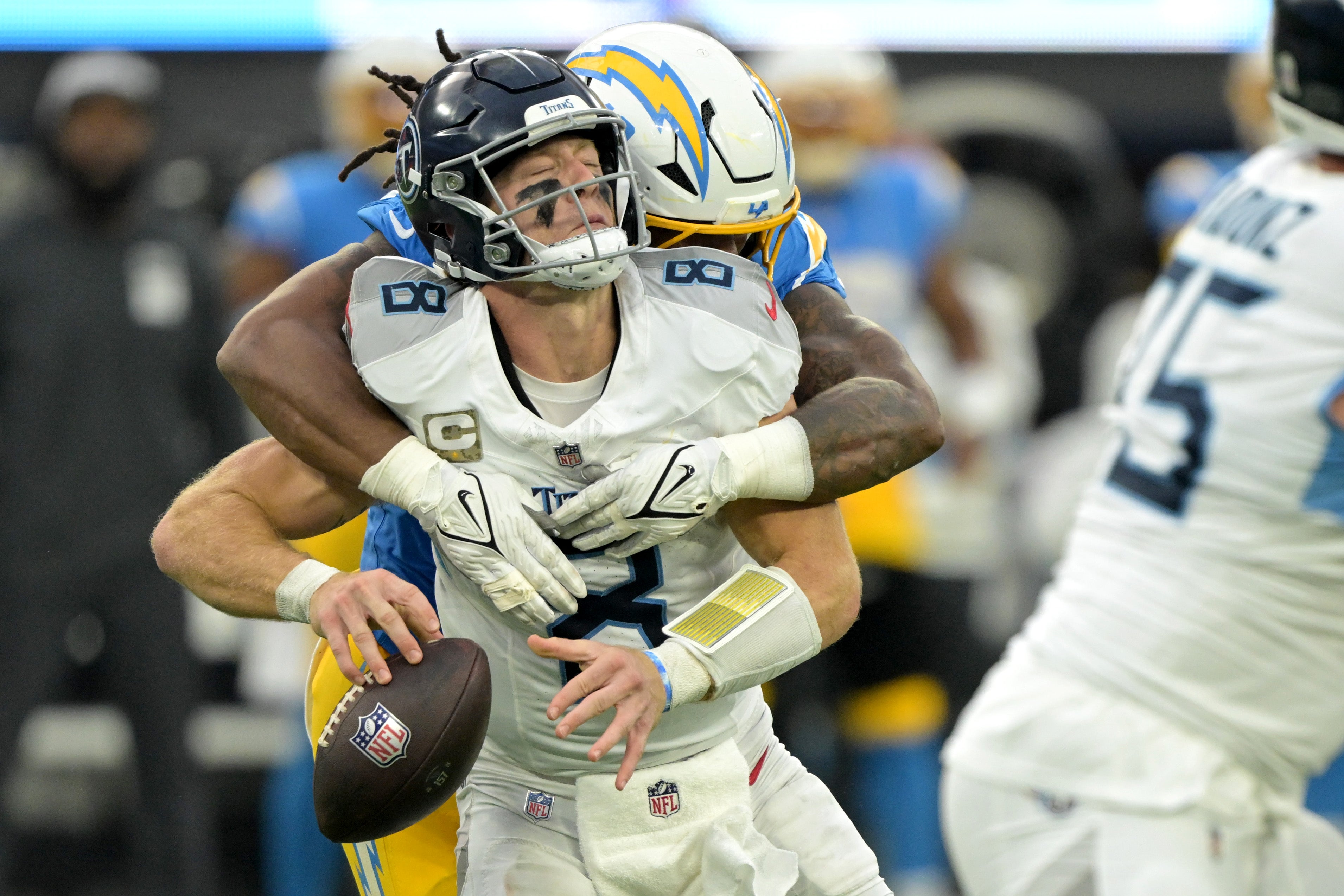 Tennessee Titans quarterback Will Levis (8) is sacked by Los Angeles Chargers linebacker Bud Dupree (48) in the second half at SoFi Stadium. Jayne Kamin-Oncea-Imagn Images