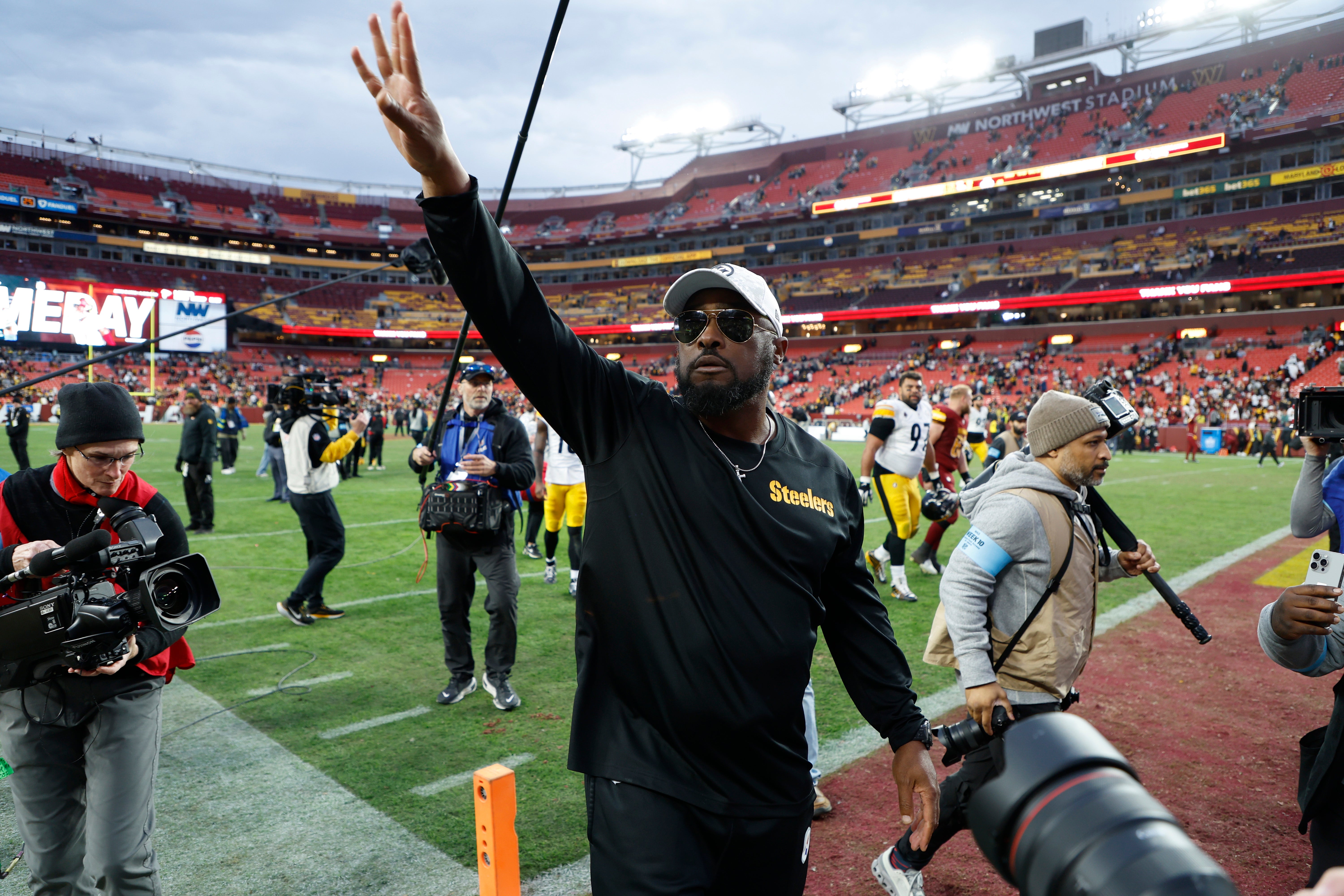 Nov 10, 2024; Landover, Maryland, USA; Pittsburgh Steelers head coach Mike Tomlin celebrates while leaving the field after the Steelers' game against the Washington Commanders at Northwest Stadium.
