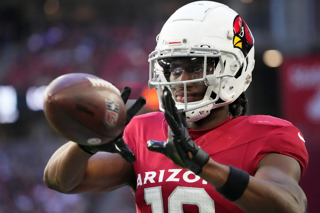 Arizona Cardinals wide receiver Marvin Harrison Jr. (18) warms up against the New York Jets during the second quarter at State Farm Stadium in Glendale, Ariz., on Sunday, Nov. 10, 2024