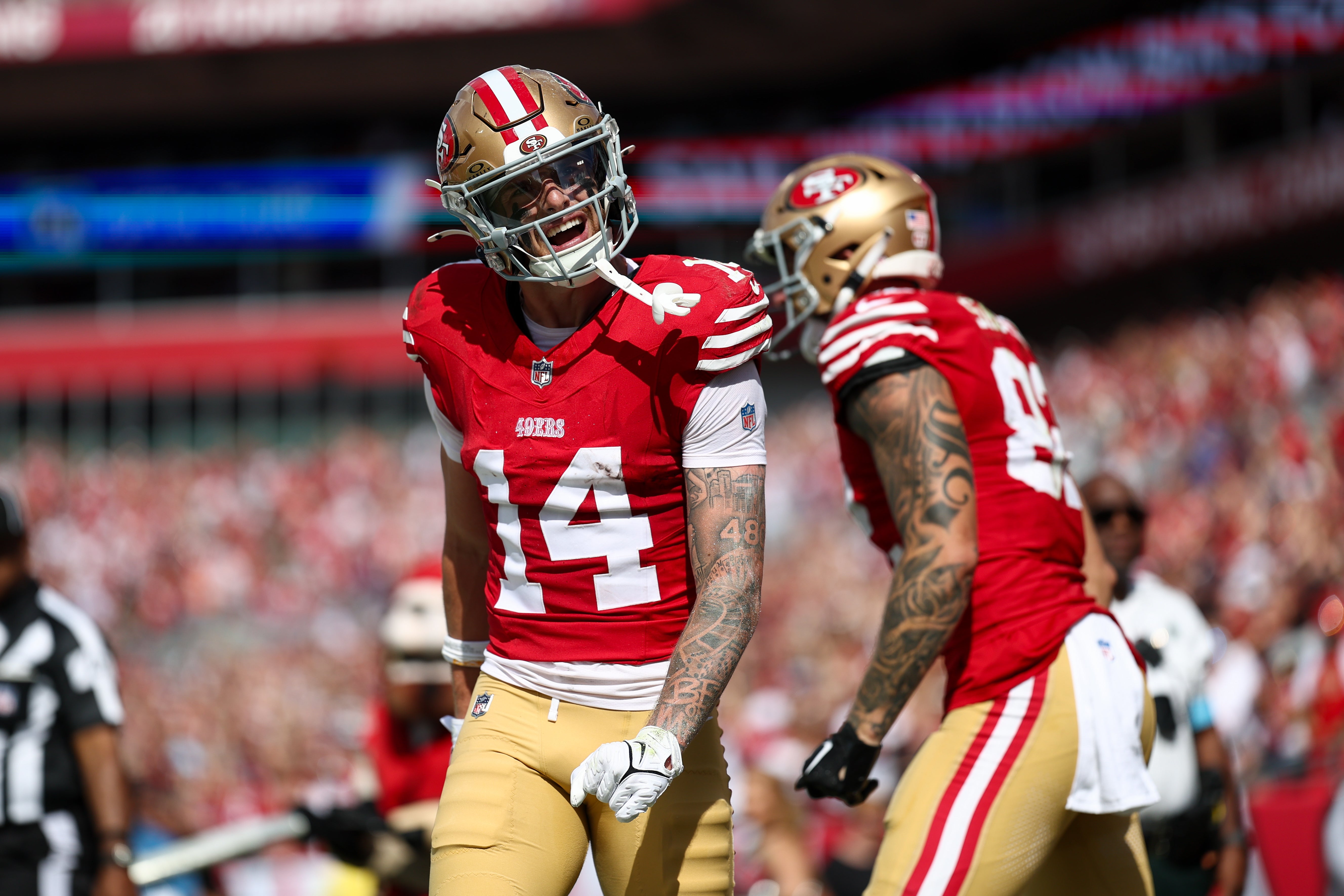 San Francisco 49ers wide receiver Ricky Pearsall (14) celebrates after scoring a touchdown against the Tampa Bay Buccaneers in the first quarter at Raymond James Stadium.