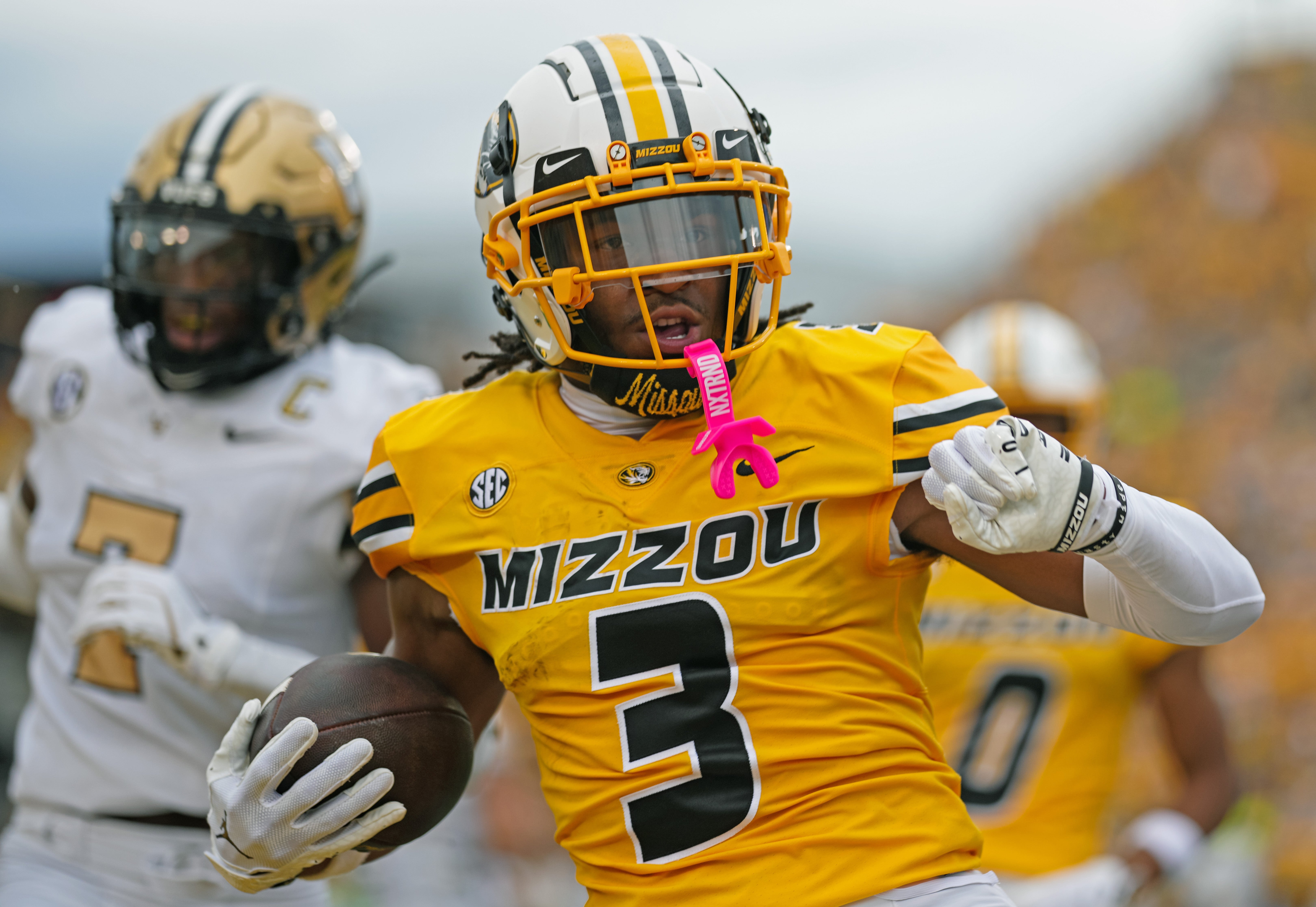 Sep 21, 2024; Columbia, Missouri, USA; Missouri Tigers wide receiver Luther Burden III (3) scores a touchdown against Vanderbilt Commodores safety Marlen Sewell (7) during the first half at Faurot Field at Memorial Stadium.