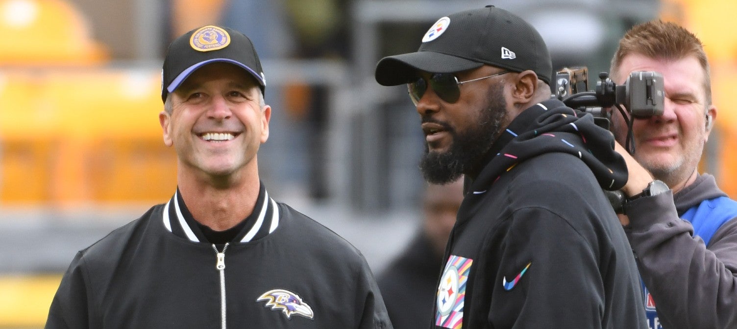 Oct 8, 2023; Pittsburgh, Pennsylvania, USA; Baltimore Ravens head coach John Harbaugh (left) and Pittsburgh Steelers head coach Mike Tomlin meet at mid-field before their game at Acrisure Stadium.