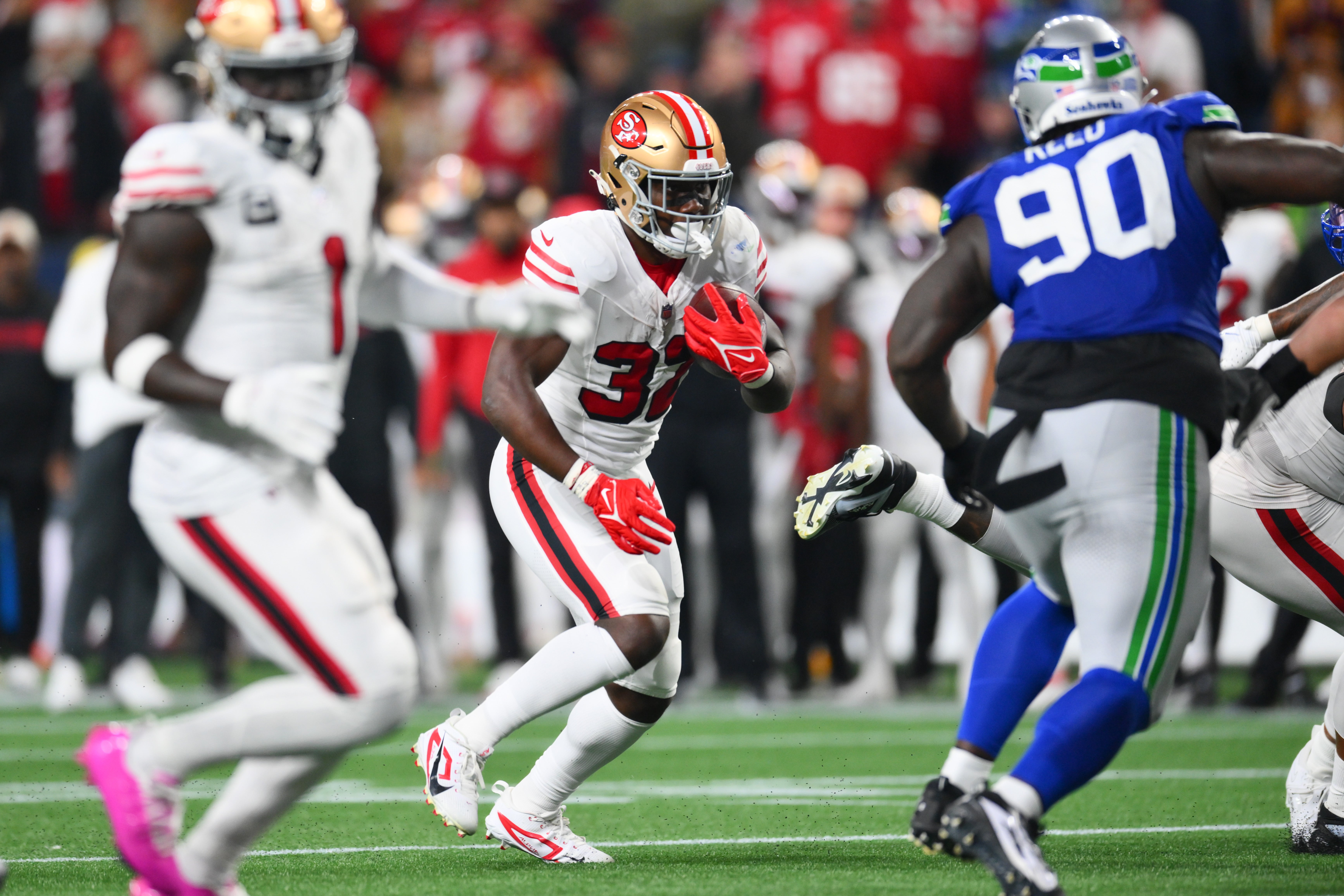 San Francisco 49ers running back Patrick Taylor Jr. (32) carries the ball against the Seattle Seahawks during the second half at Lumen Field.
