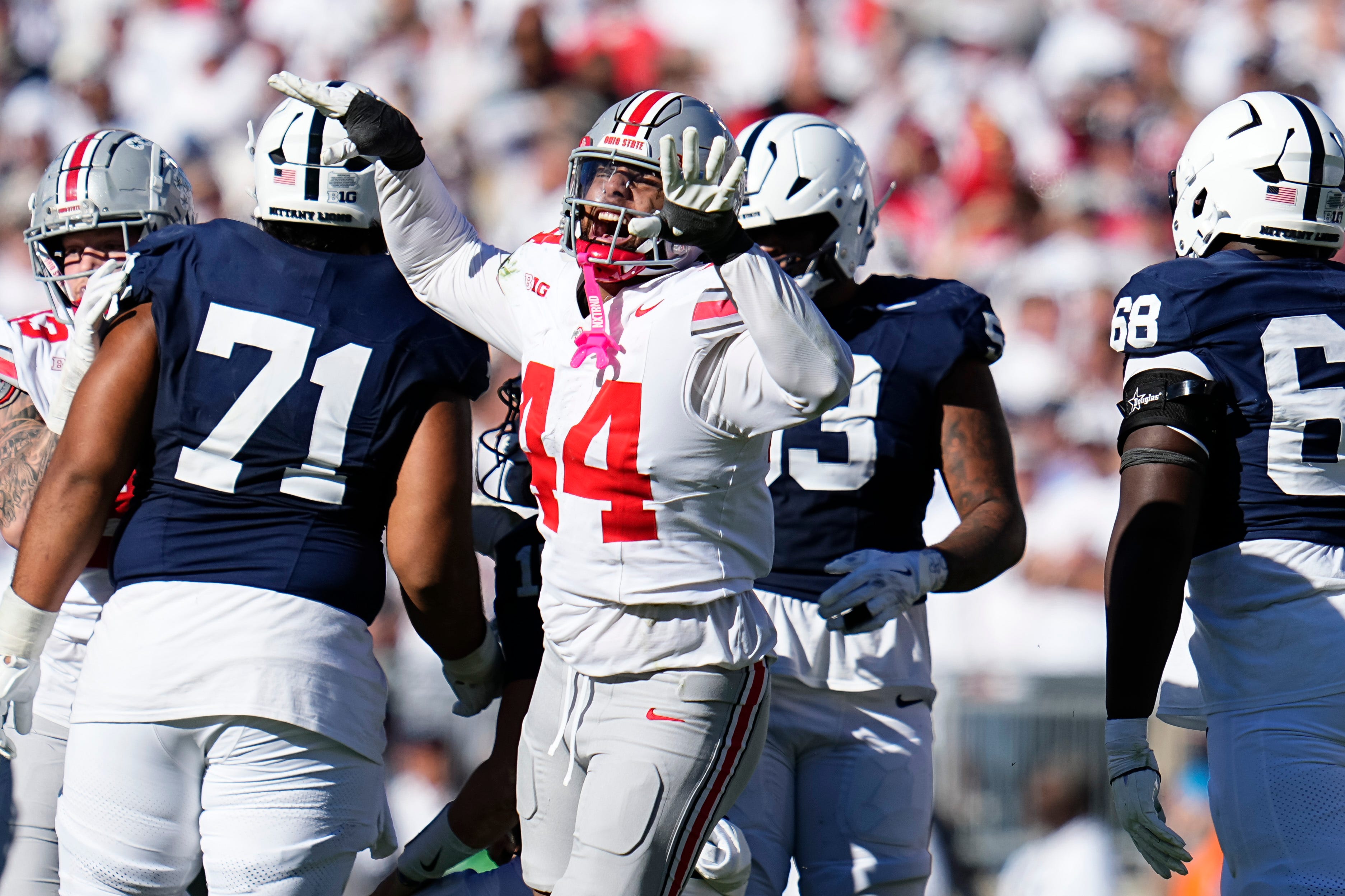 Ohio State Buckeyes defensive end JT Tuimoloau (44) celebrates a sack of Penn State Nittany Lions quarterback Drew Allar (15) during the second half of the NCAA football game at Beaver Stadium in University Park, Pa. on Saturday, Nov. 2, 2024. Ohio State won 20-13.