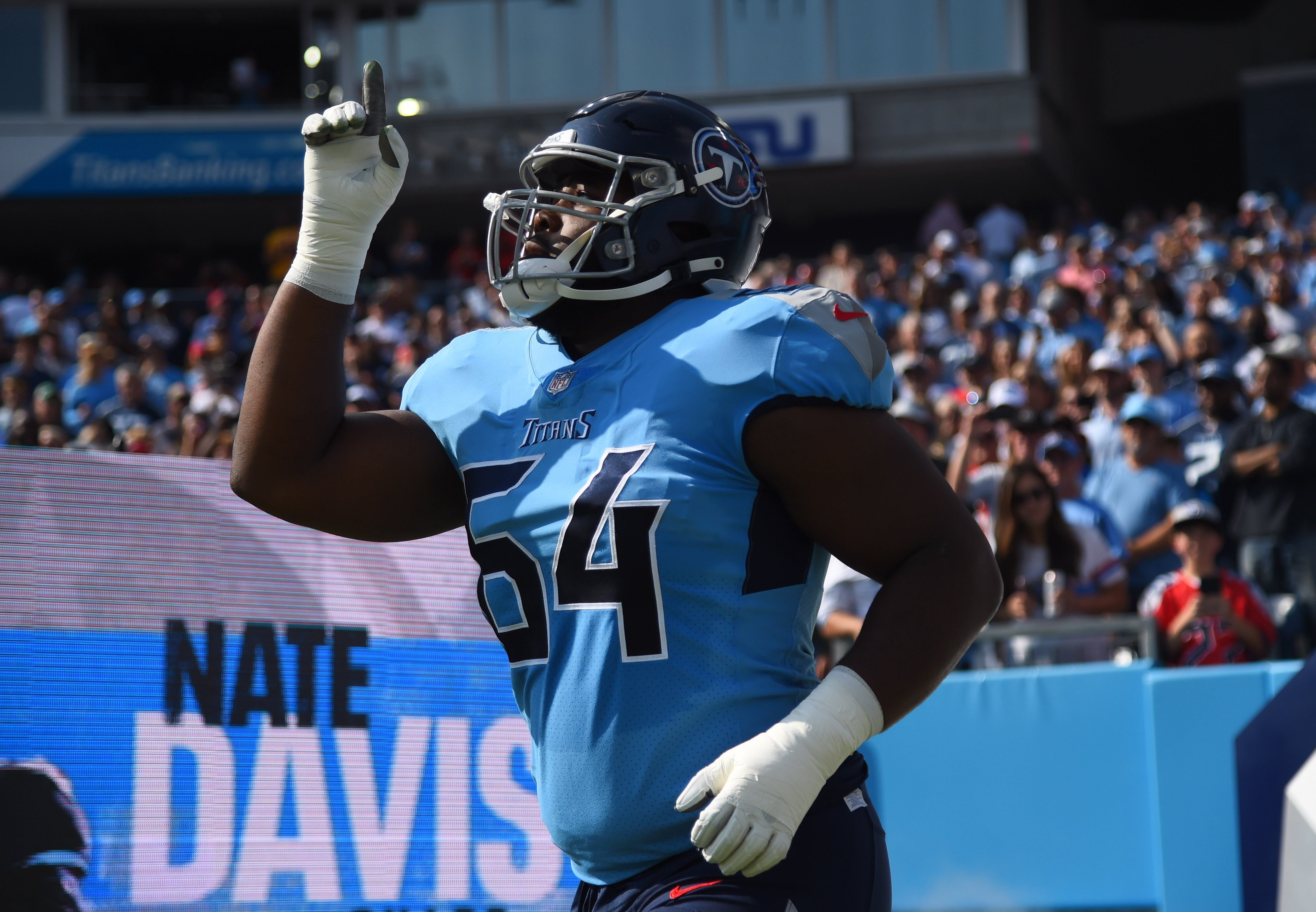 Tennessee Titans guard Nate Davis (64) takes the field before the game against the Kansas City Chiefs at Nissan Stadium. Christopher Hanewinckel-Imagn Images